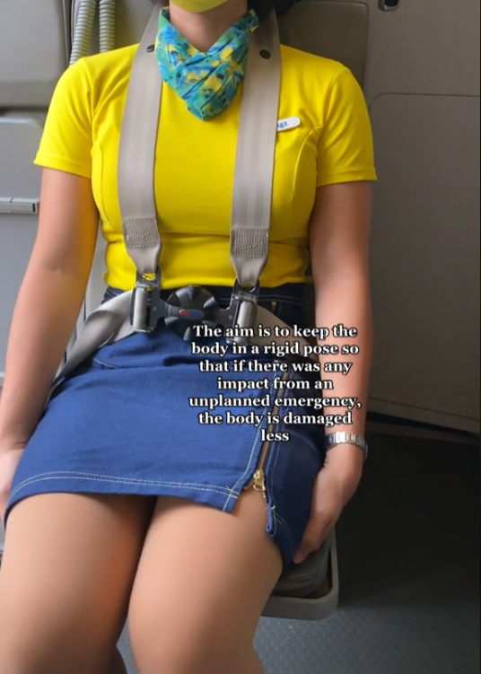 Why do flight attendants sit on their hands during takeoff and landing: the reason is simple
