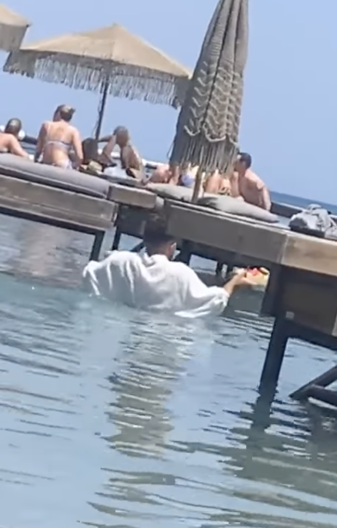 A scandal erupts in Greece over a bar where waiters served tourists while standing in water