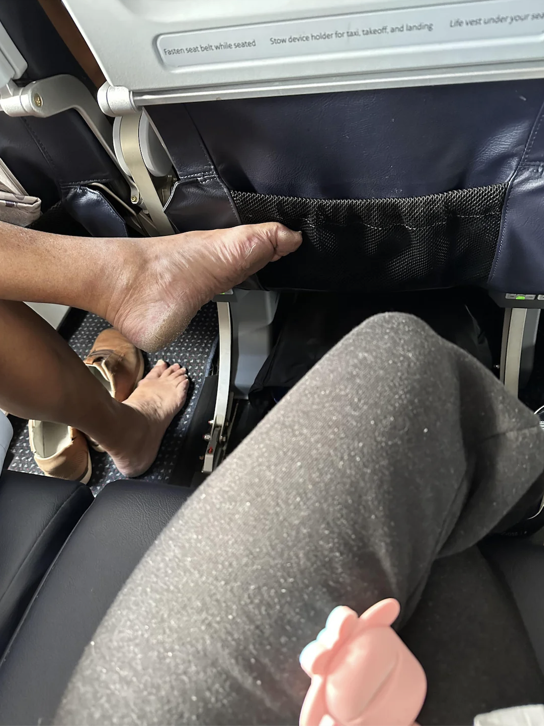 What to do if your neighbor's feet invade your space on an airplane: advice from an etiquette expert