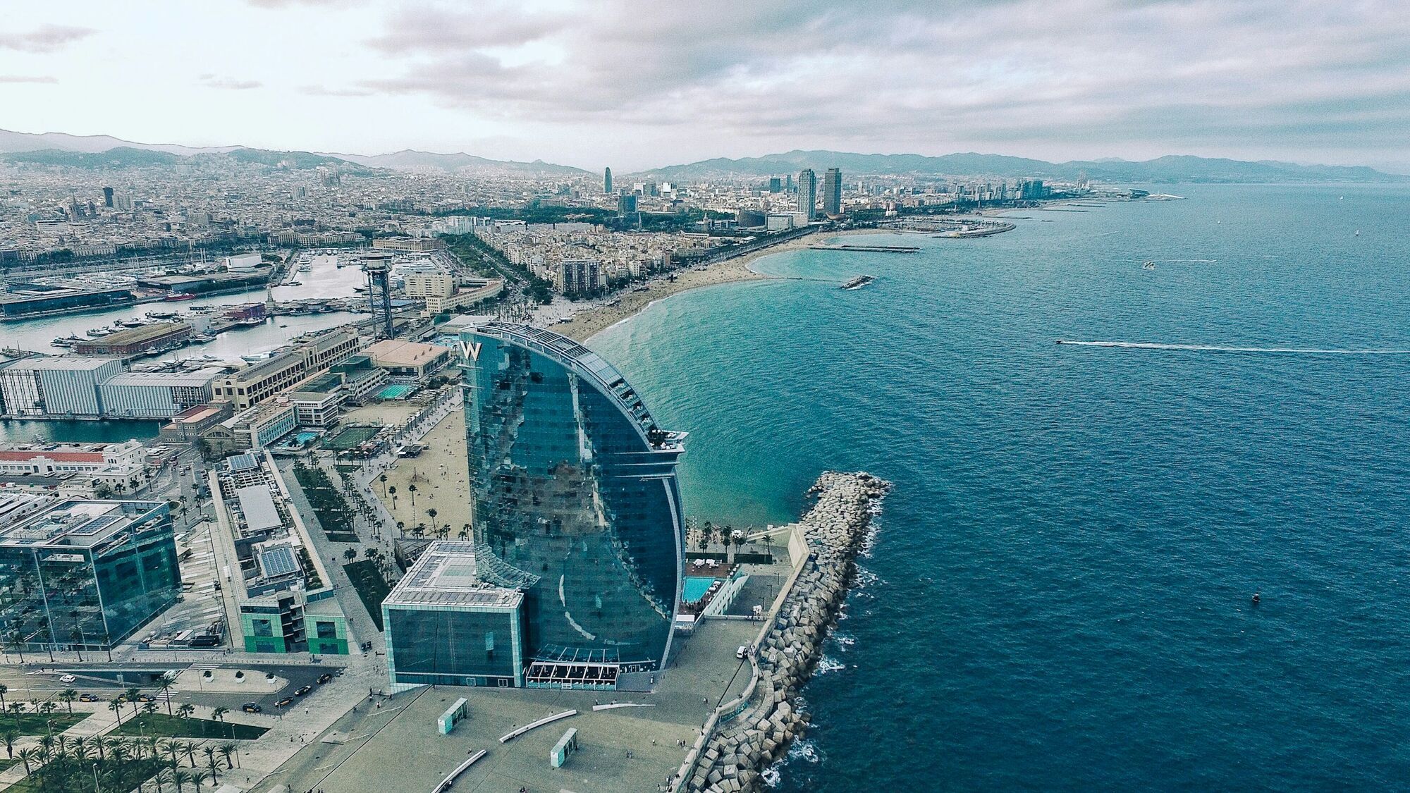 Aerial view of Barcelona coastline with iconic W Hotel and Mediterranean Sea