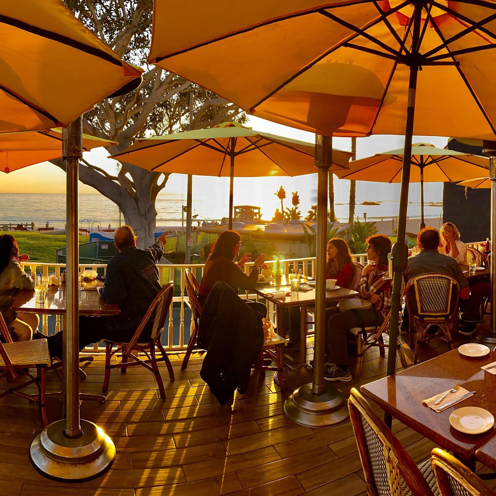 Outdoor dining with ocean view at C'est La Vie Restaurant