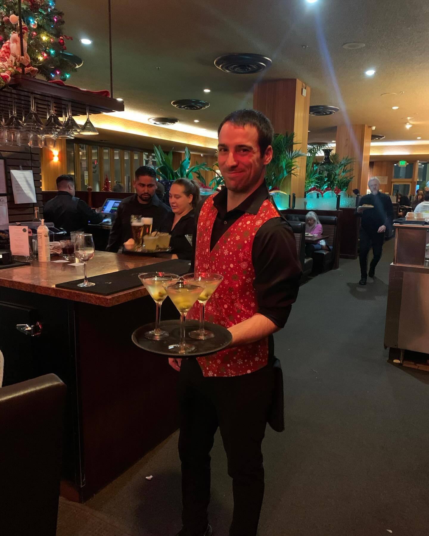 Server at Original Joe's carrying martinis