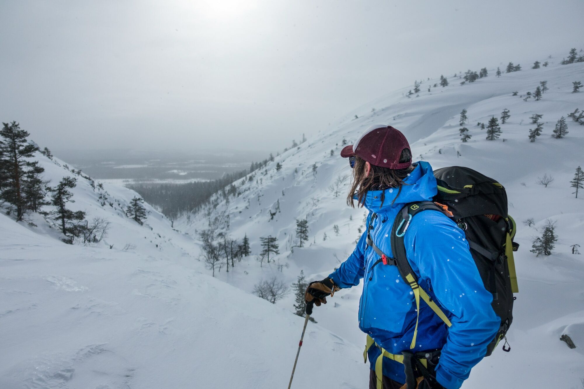 Hiker dressed for winter trekking in snowy Finnish Lapland