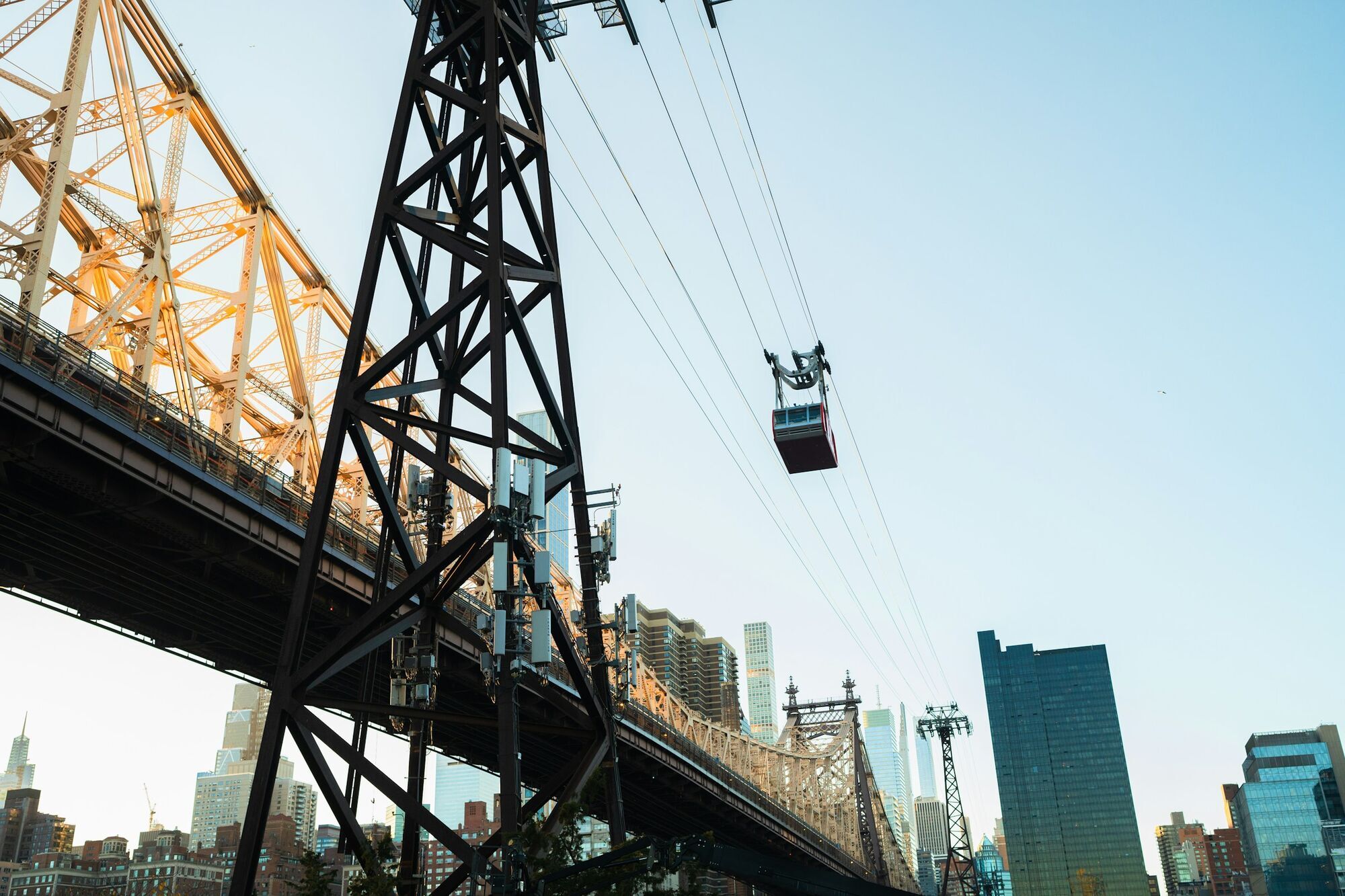 Roosevelt Island Tramway crossing the East River with city skyline in the background