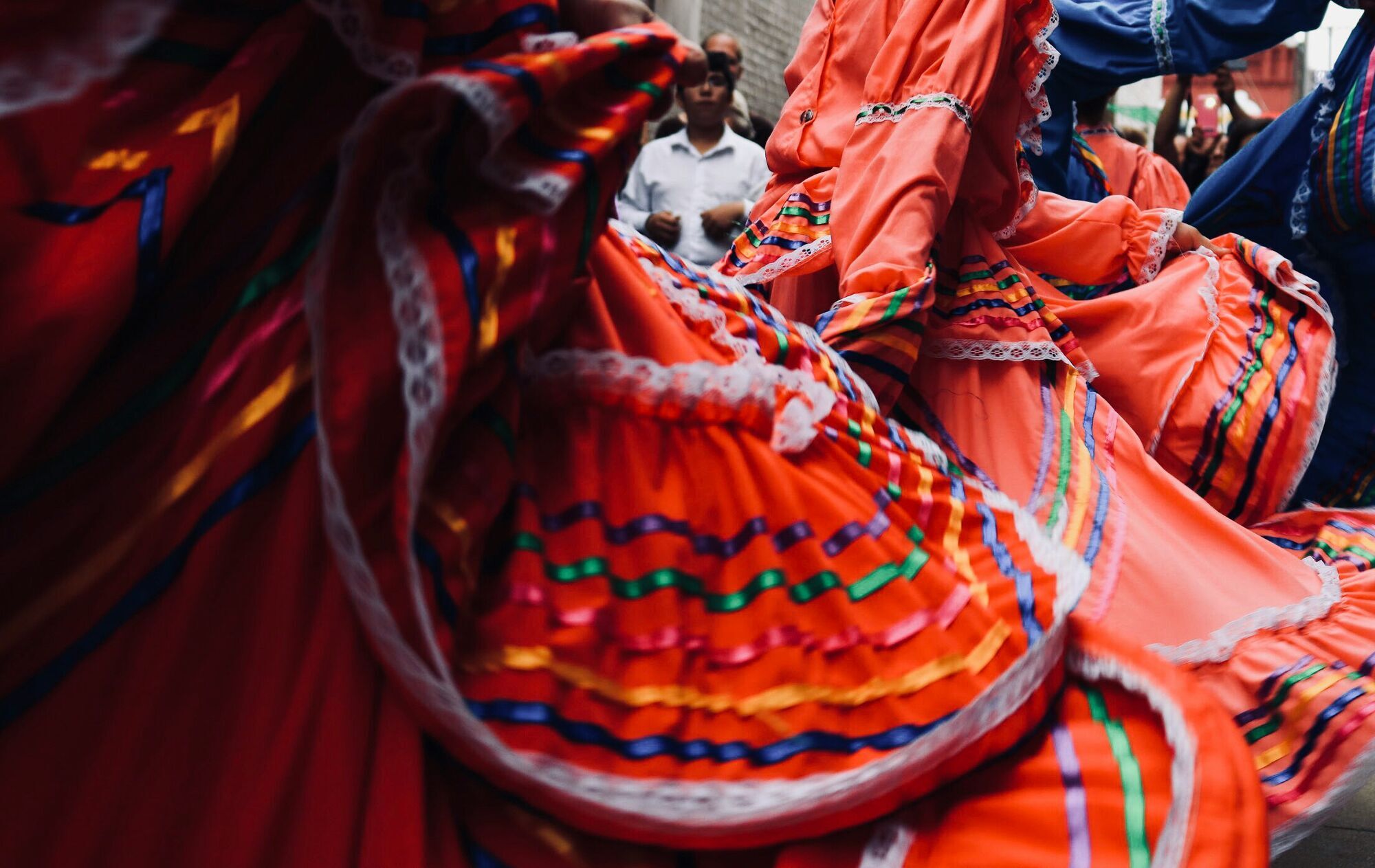 man-standing-behind-dancers