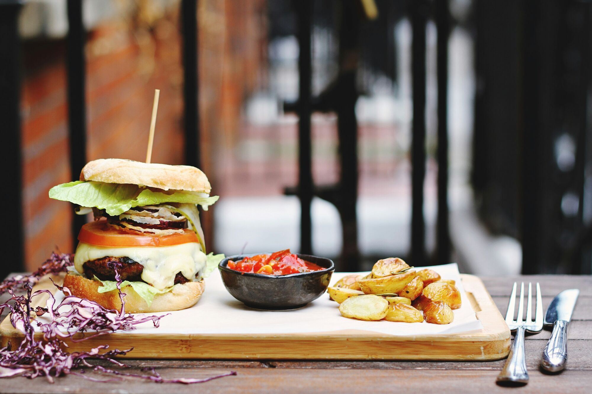 hamburger beside bowl on tray