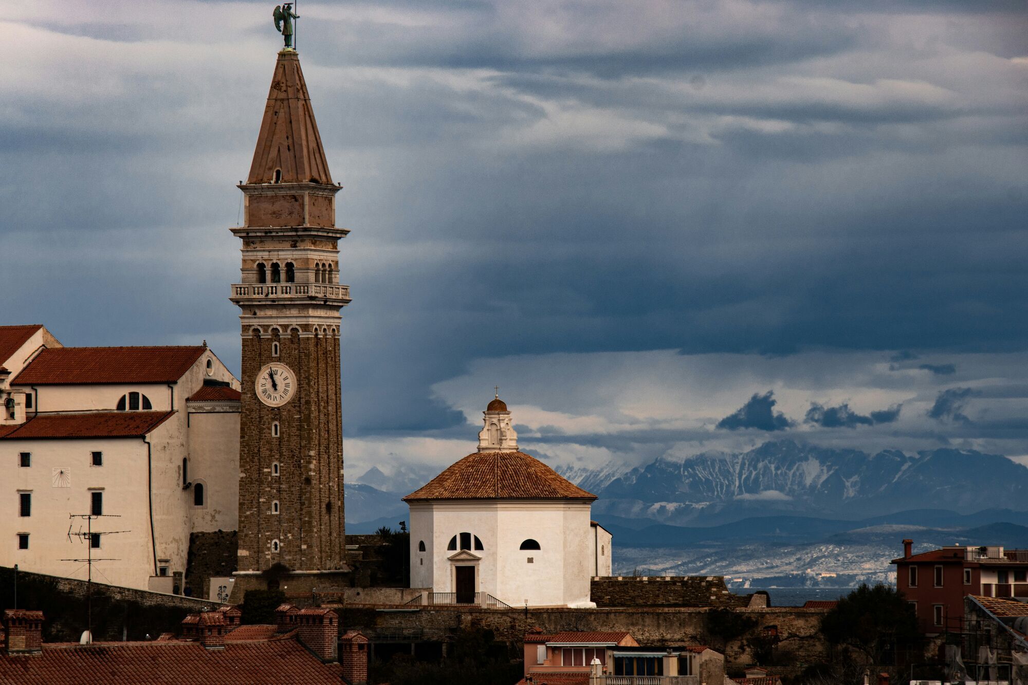 A shot of Piran, Slovenia with the Julian Alps in the background.