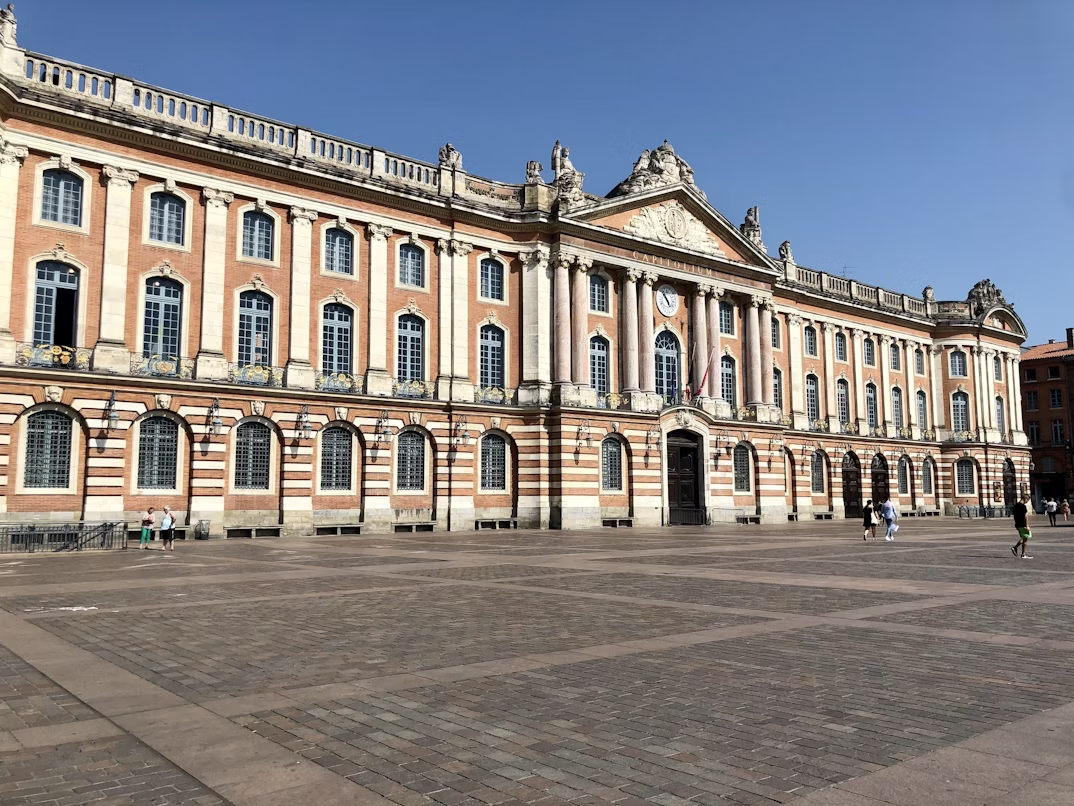 The Capitole de Toulouse building with its grand neoclassical façade on a sunny day
