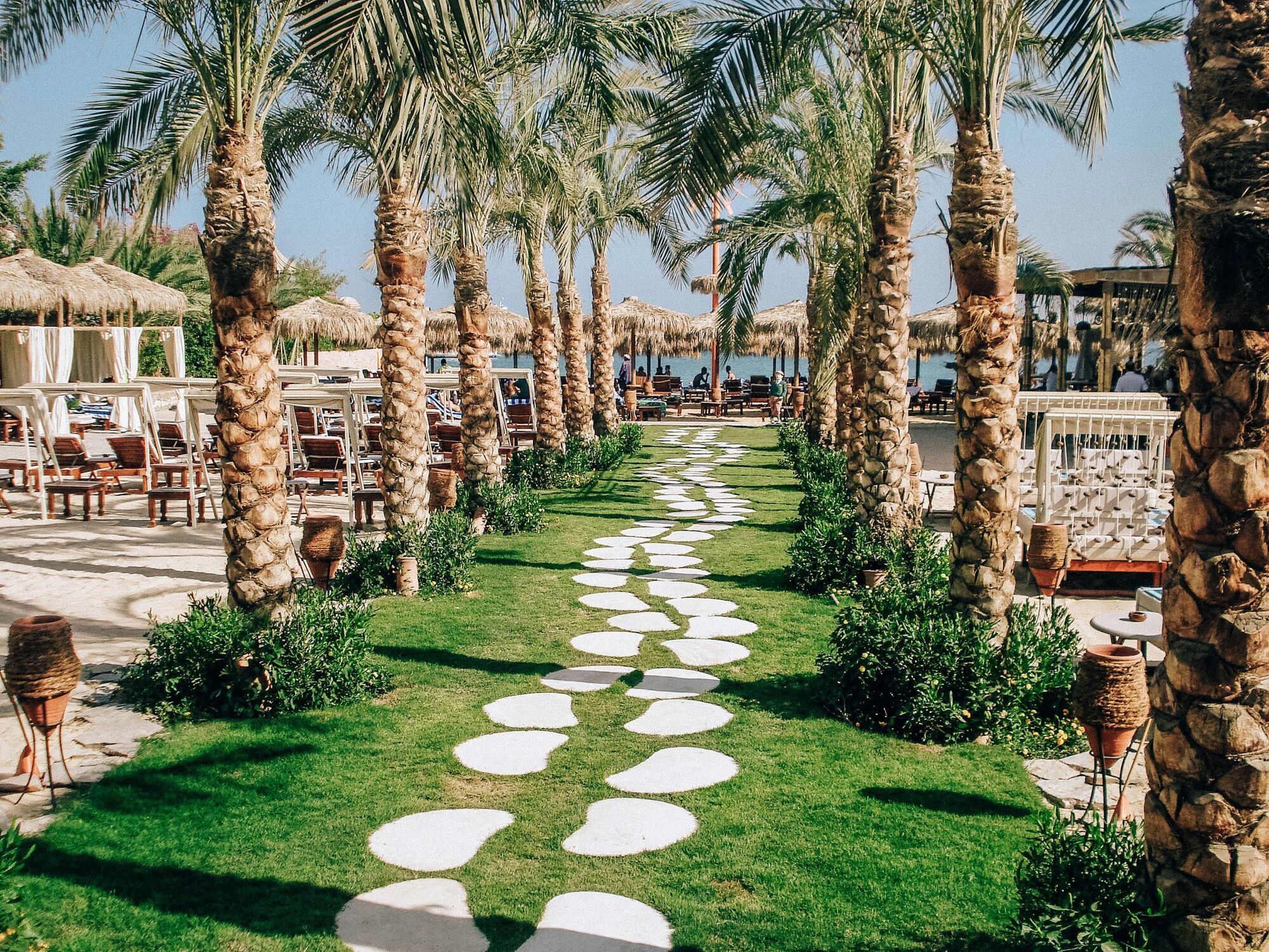 Palm-lined walkway leading to Hurghada beach
