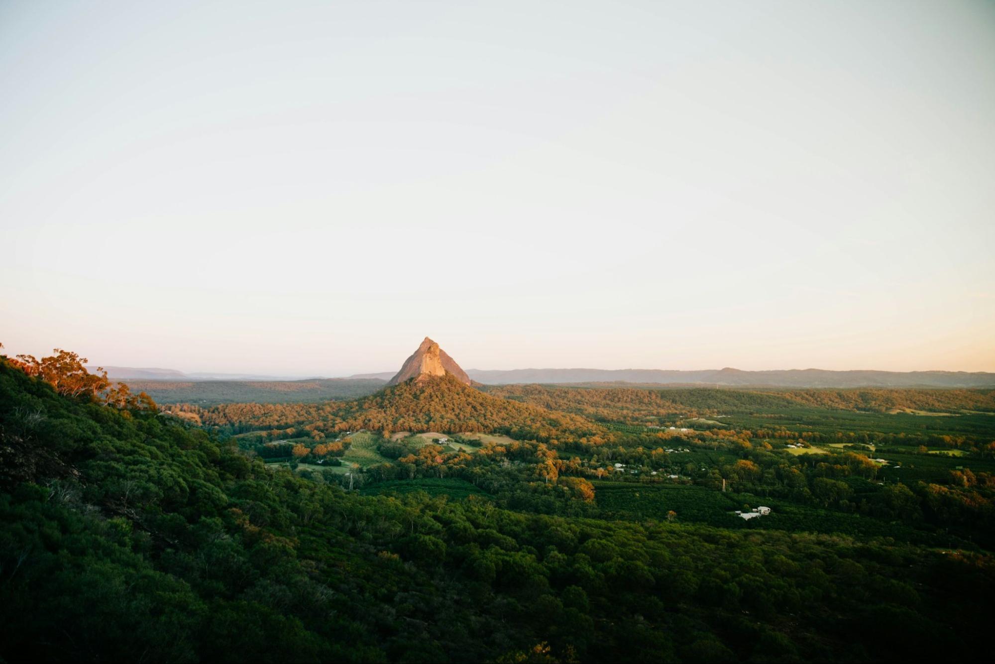 Scenic view of the Glass House Mountains at sunset