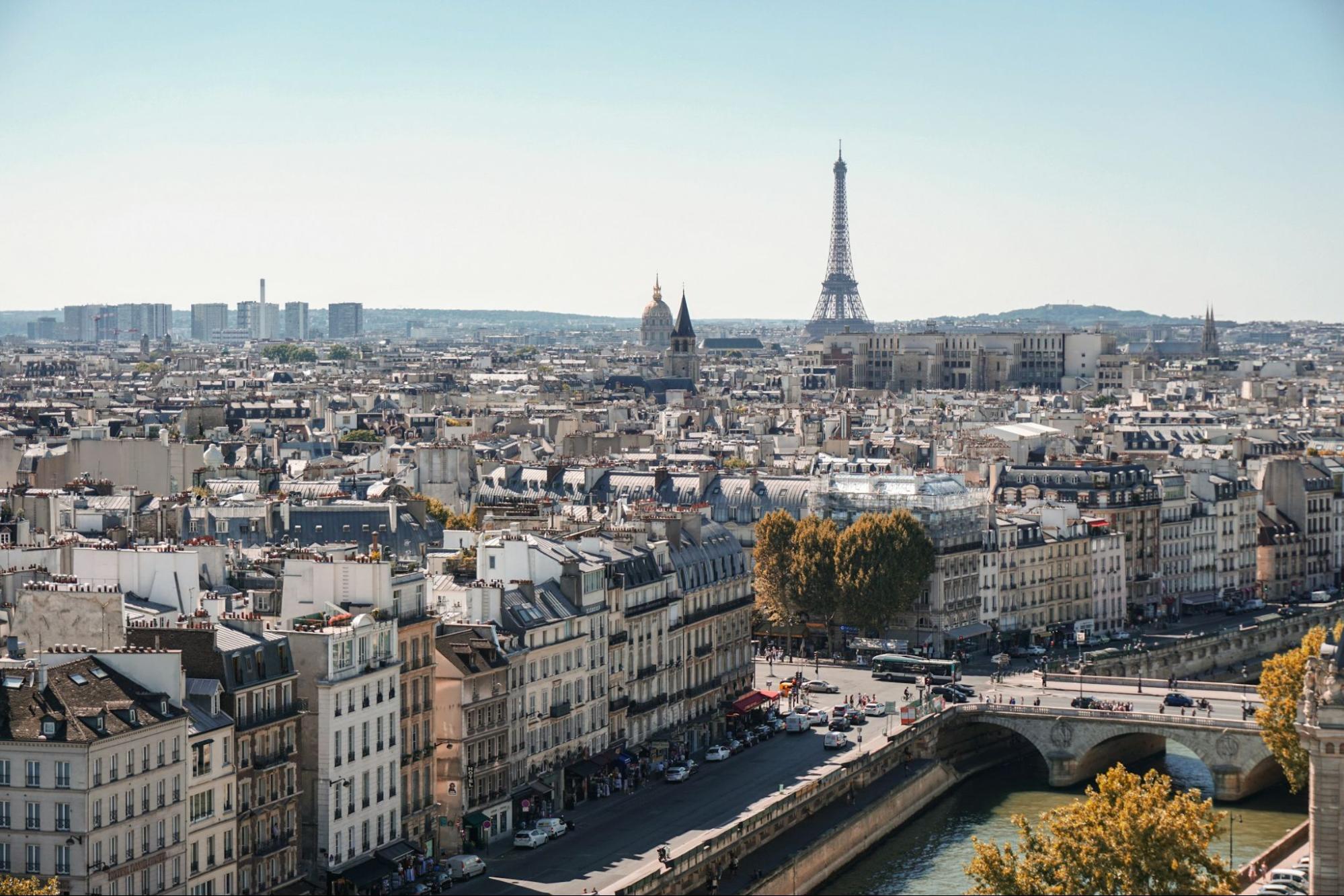 A panoramic view of Paris with the Eiffel Tower in the distance