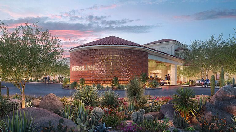 Exterior of Kimpton Miralina Resort surrounded by desert plants