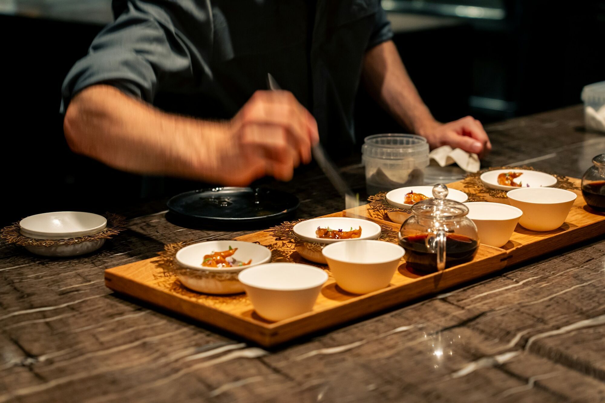 Chef preparing dishes with tea pairing