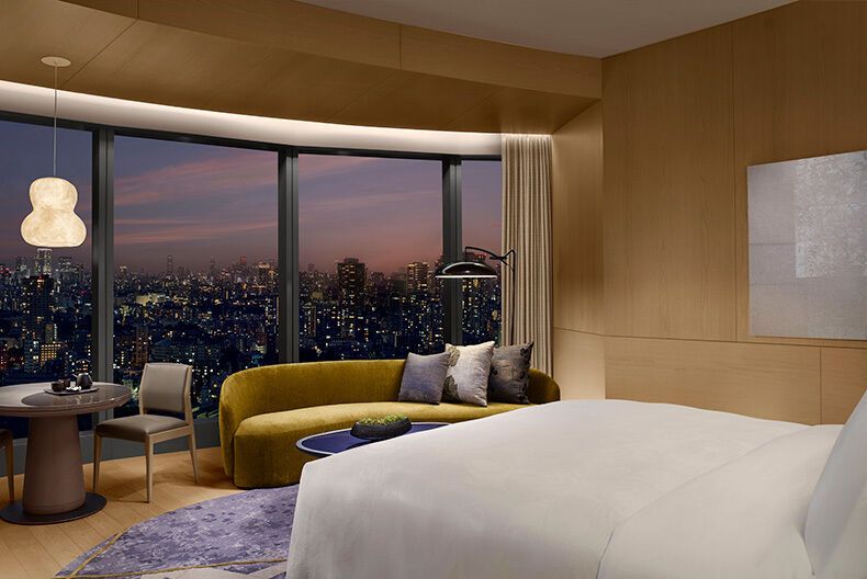 Modern hotel room overlooking Tokyo’s city skyline at dusk