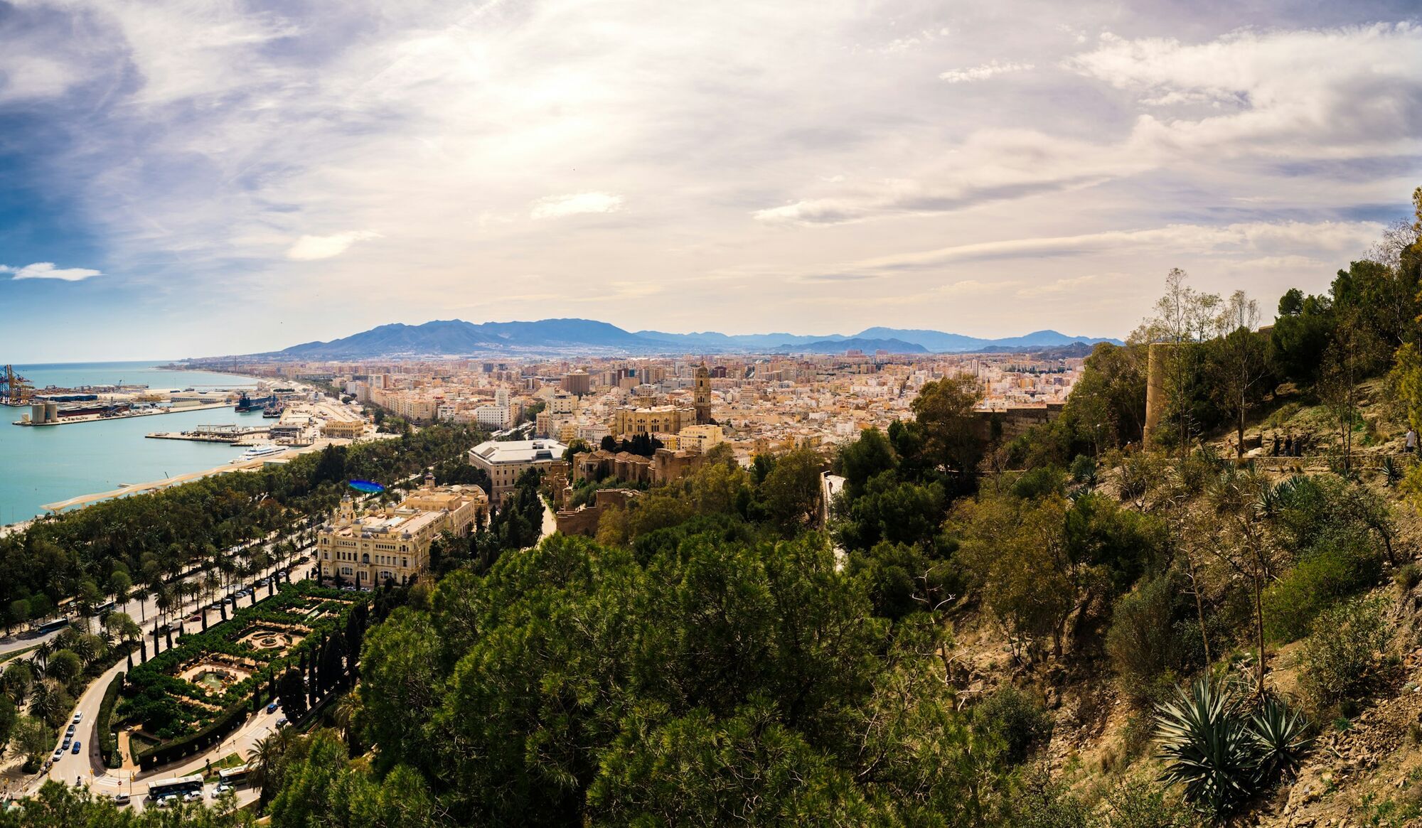 A panoramic view of Malaga’s coastline and city centre under clear skies
