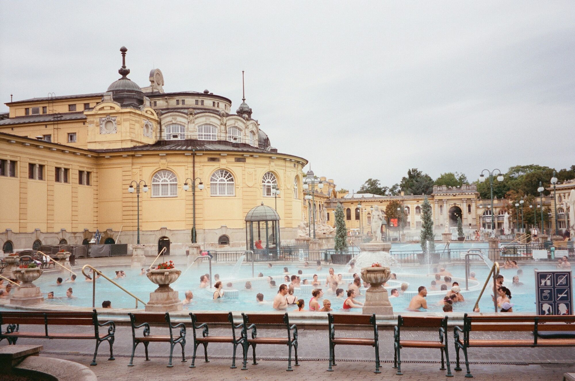 People relaxing in the historic Széchenyi thermal baths in Budapest