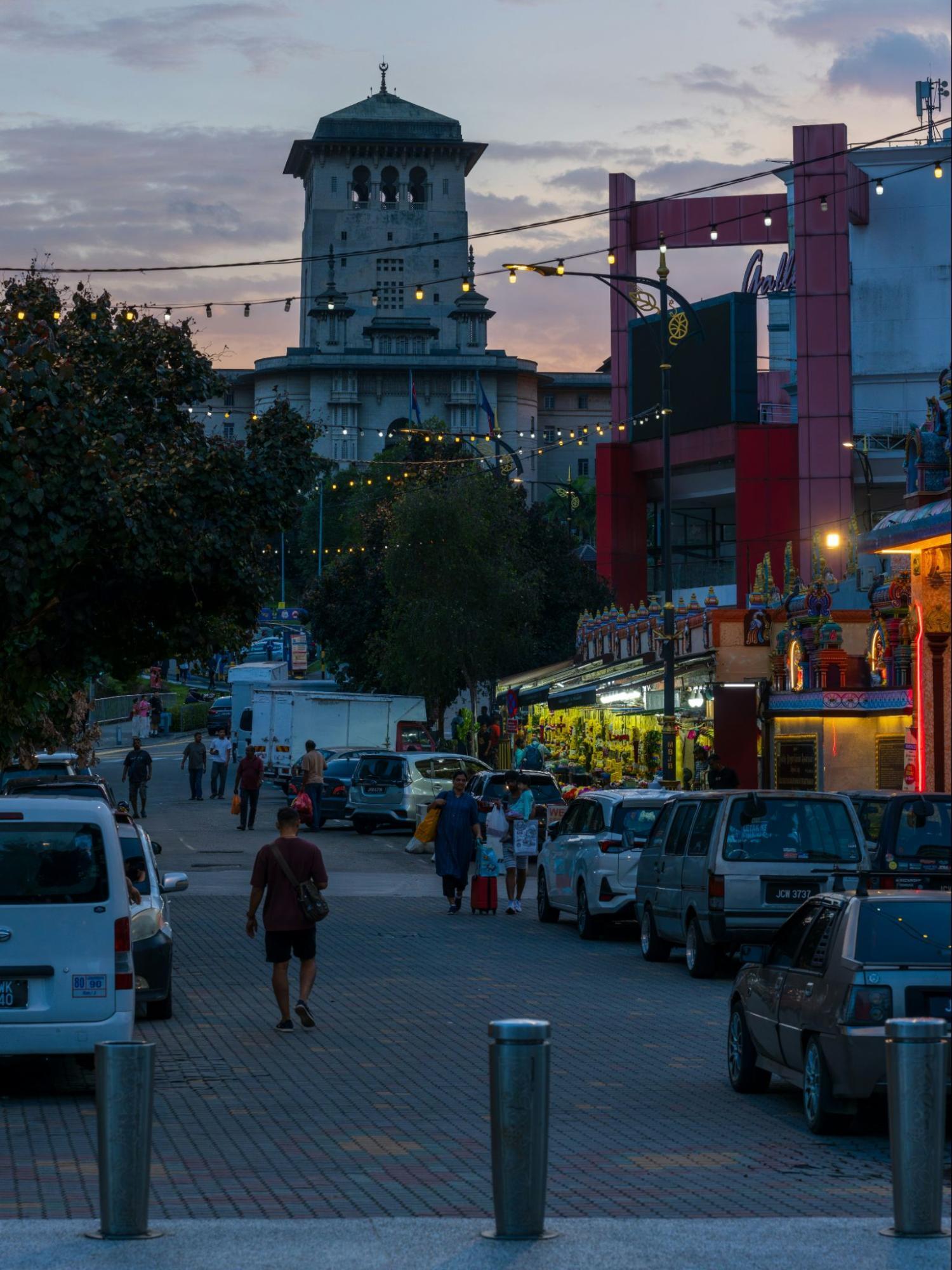 Evening street scene in Johor Bahru with historic architecture and local shops