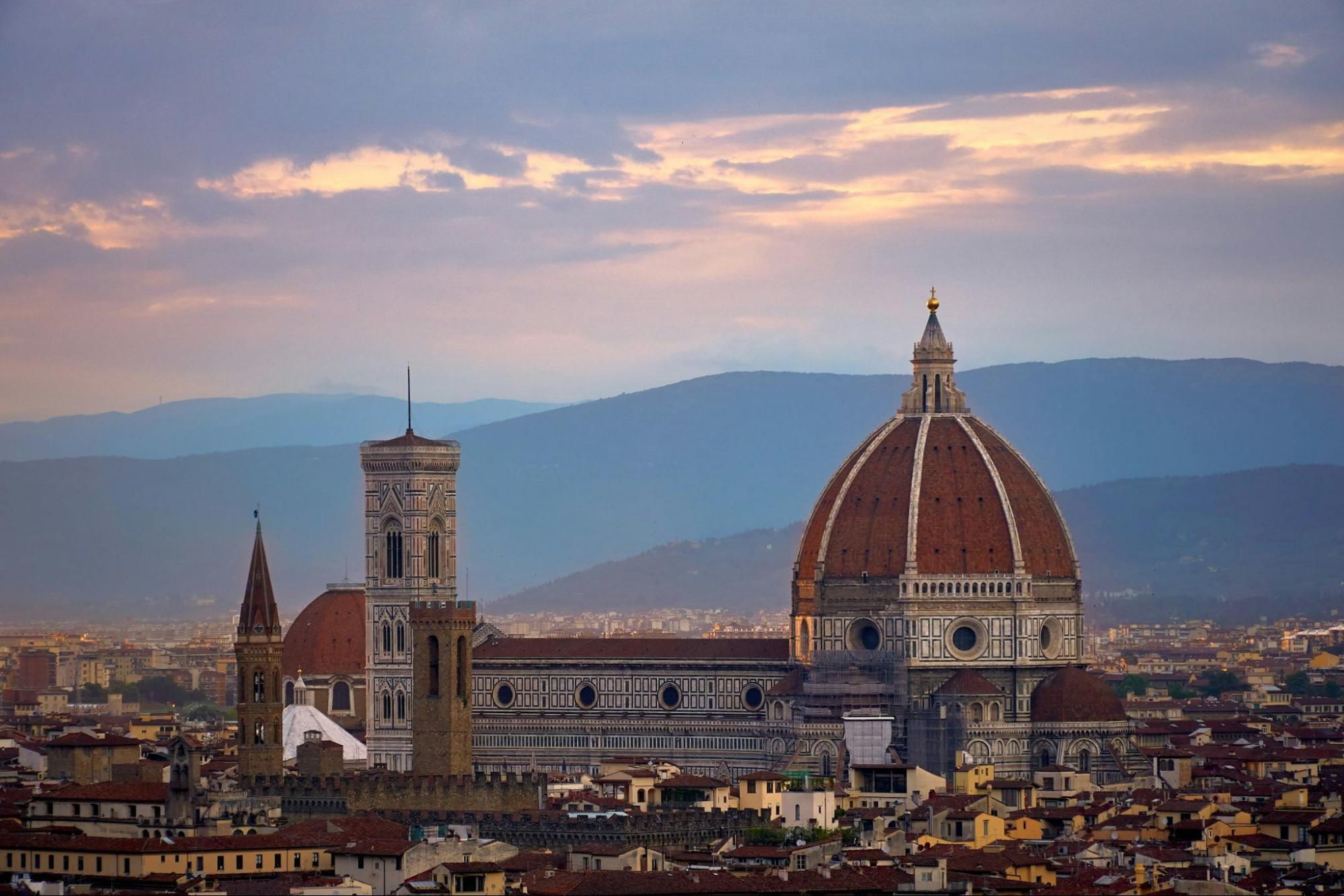 Florence Cathedral with Brunelleschi’s Dome at sunset, seen from a hillside viewpoint