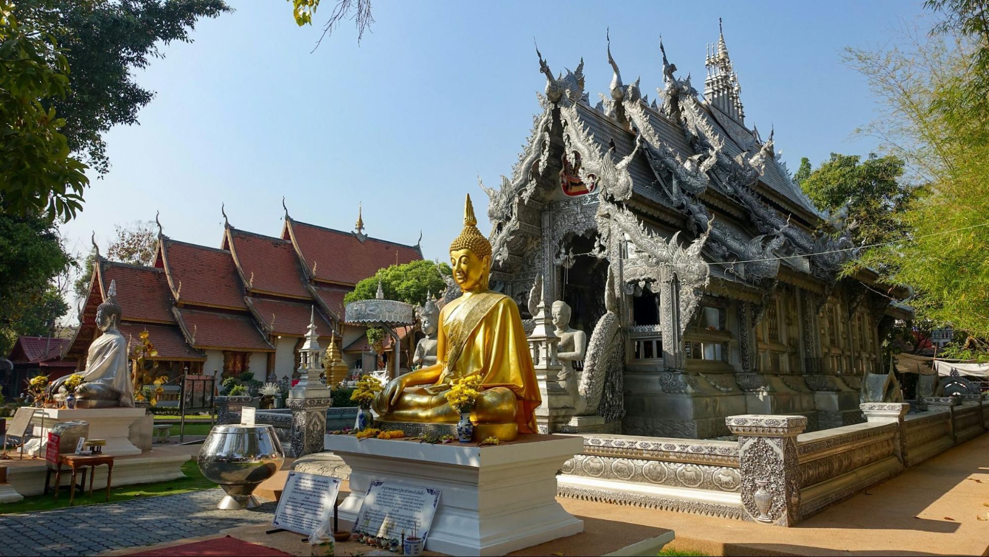 Golden Buddha statue in front of Chiang Mai’s Silver Temple