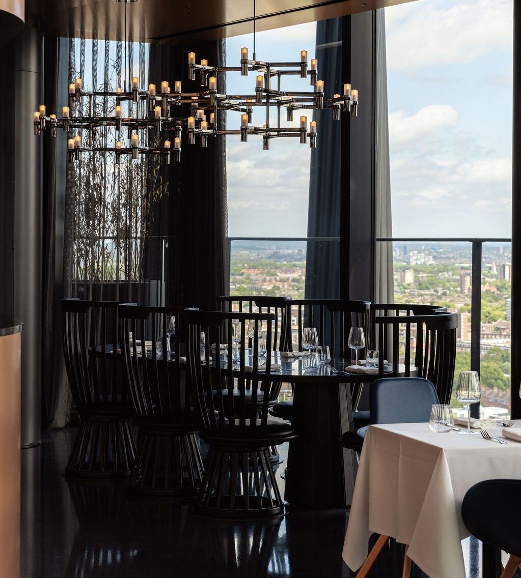 Elegant restaurant interior with panoramic city view