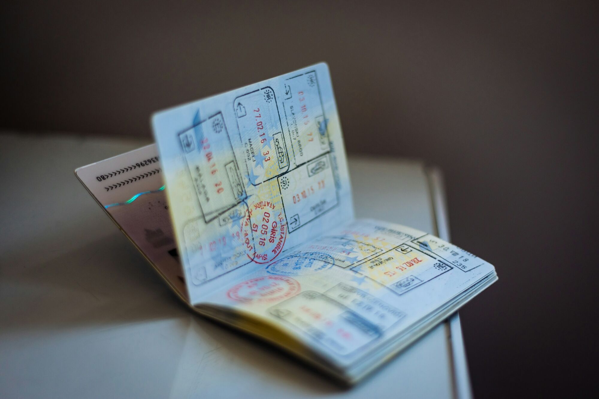 Open passport showing multiple entry and exit stamps