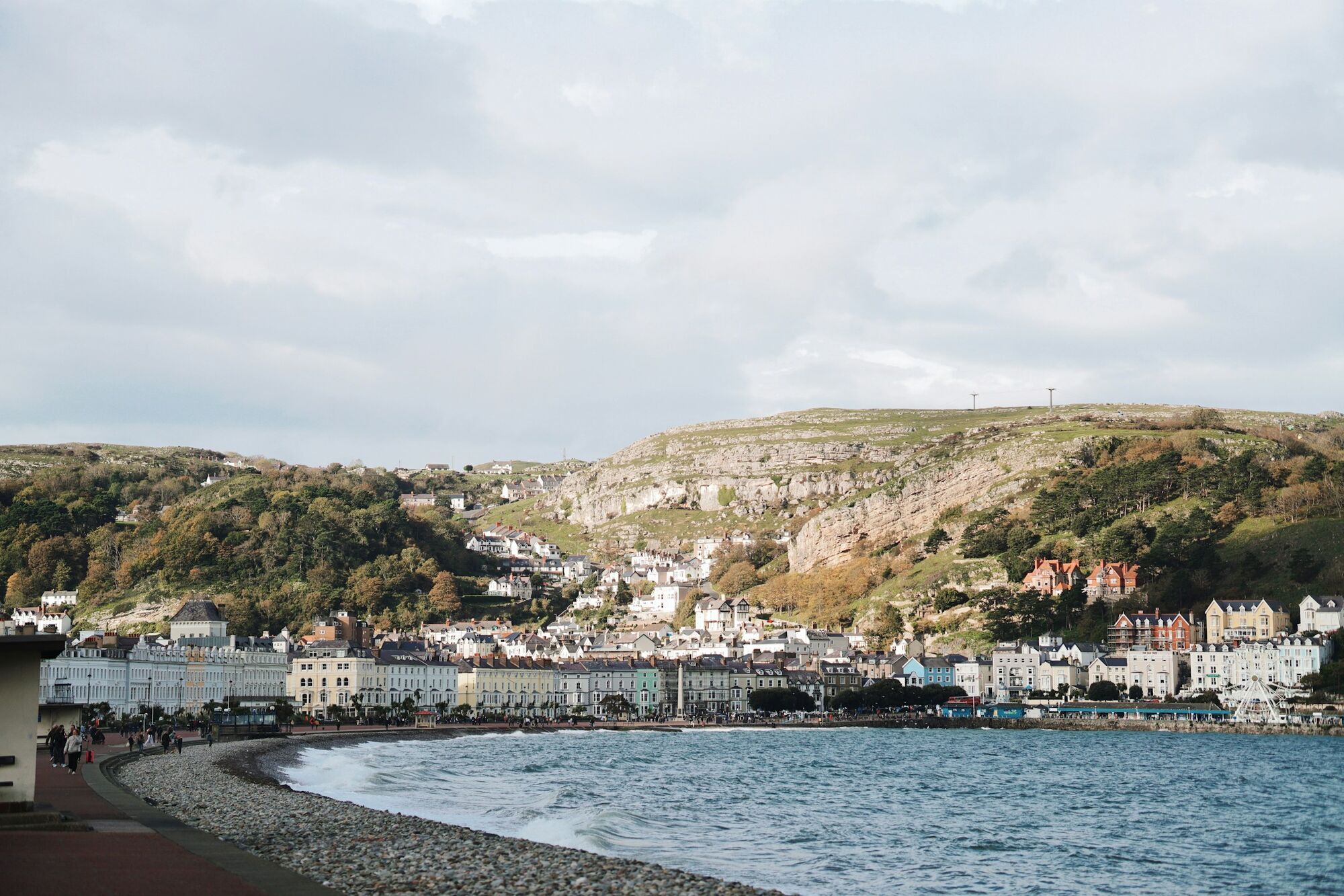Llandudno seafront with hills, houses, and the coastline on a clear day