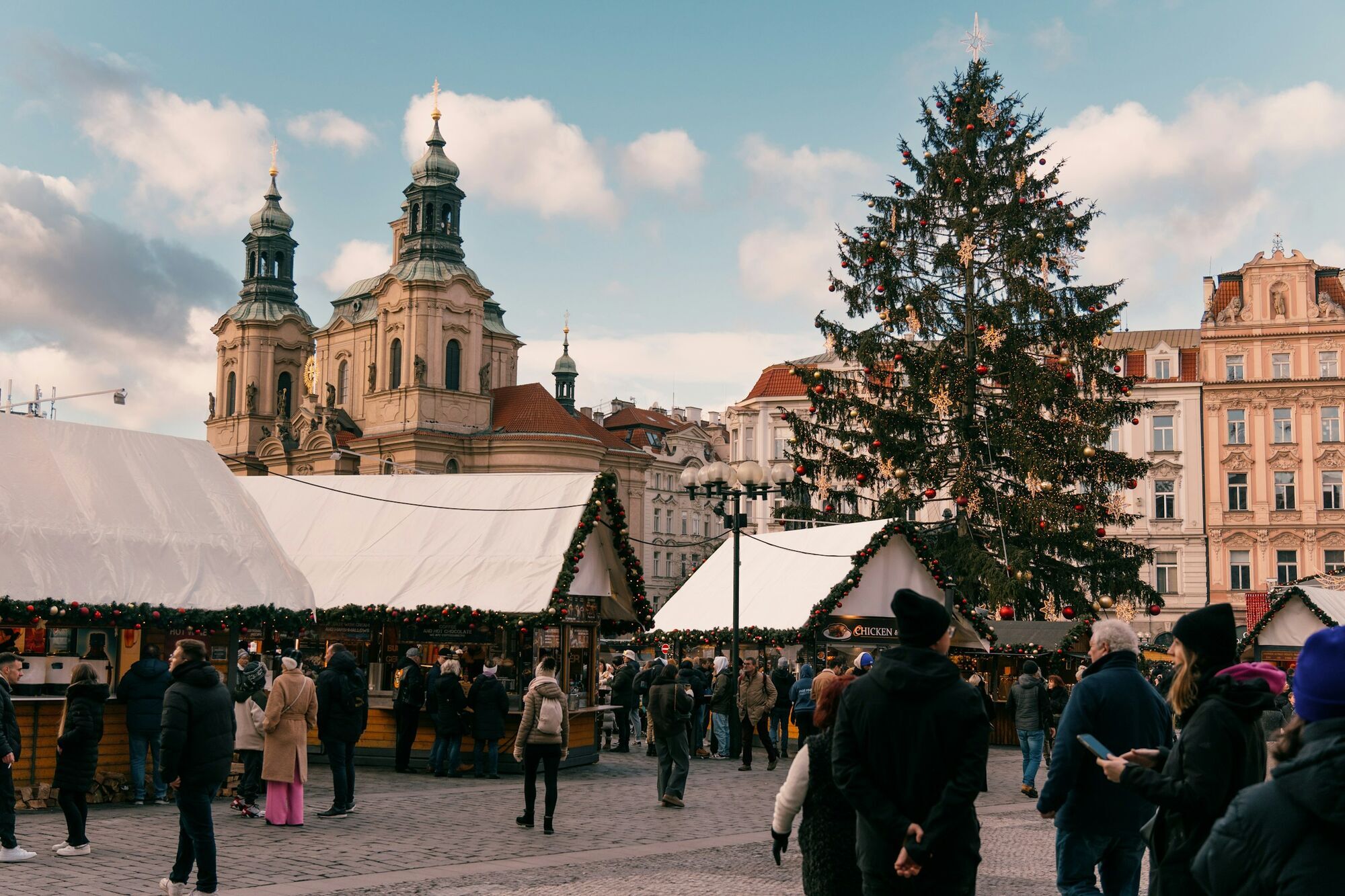 Christmas market huts and tree in Prague’s Old Town