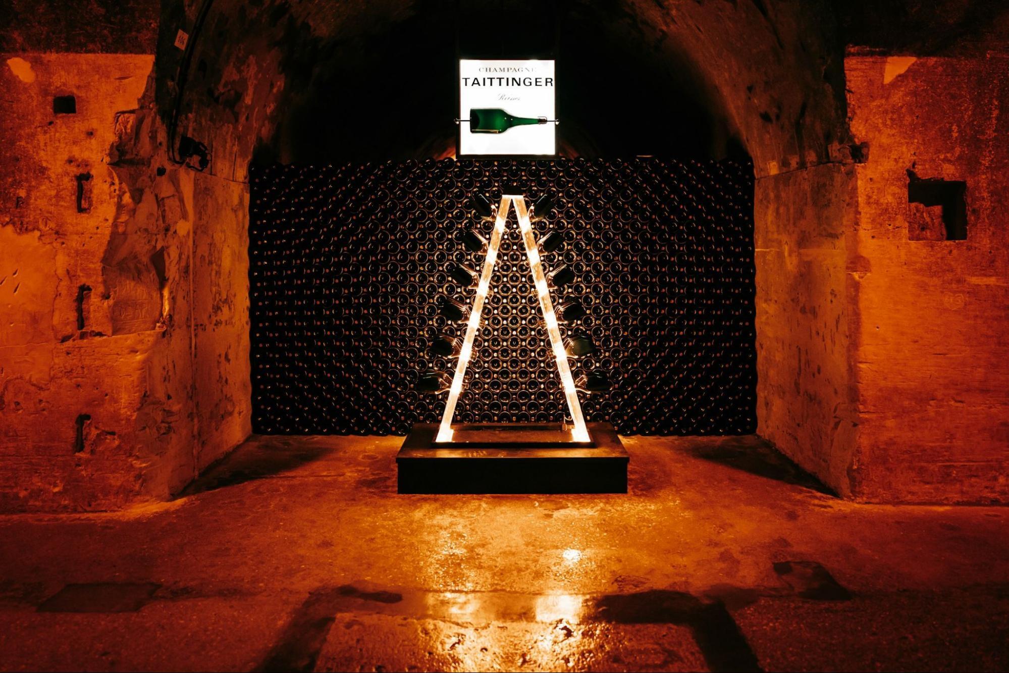 Underground Champagne cellar with illuminated bottle rack display