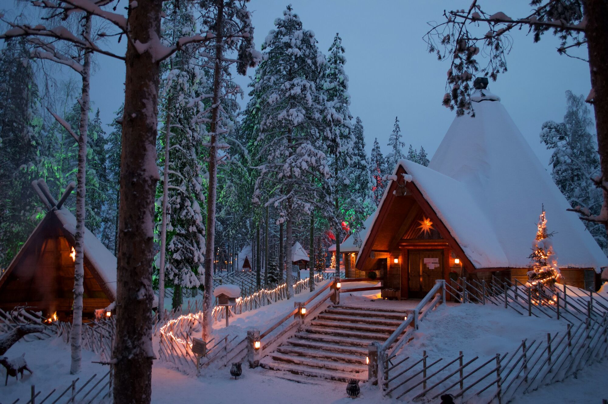 Winter cabins surrounded by snow in Rovaniemi, Finland