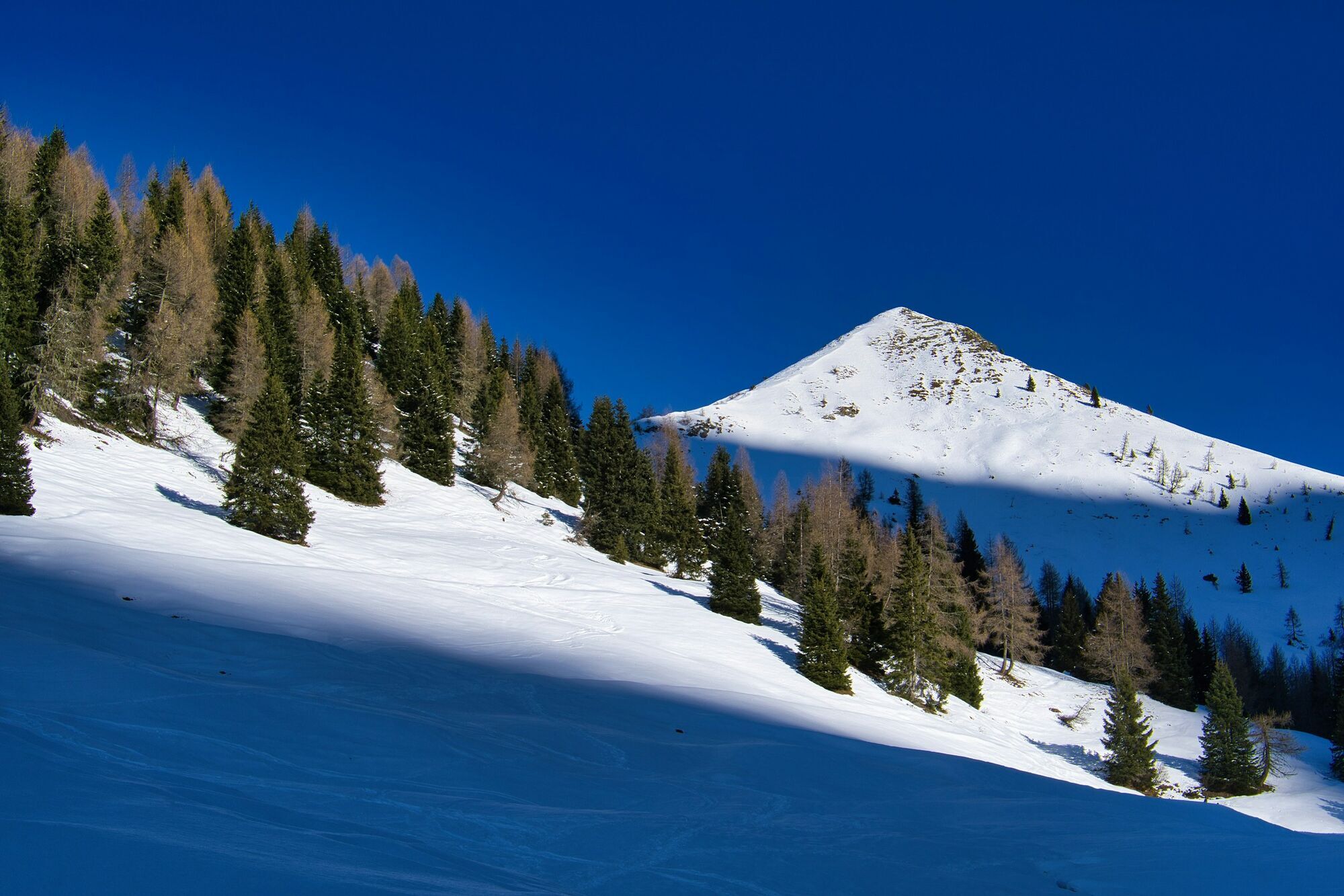 Snow-covered slope in the Italian Alps during winter