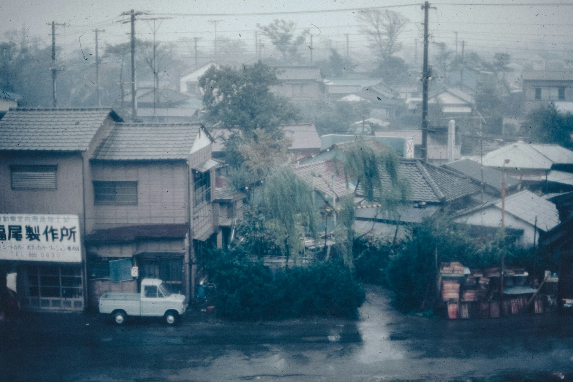 A quiet residential street under heavy rain in the Philippines