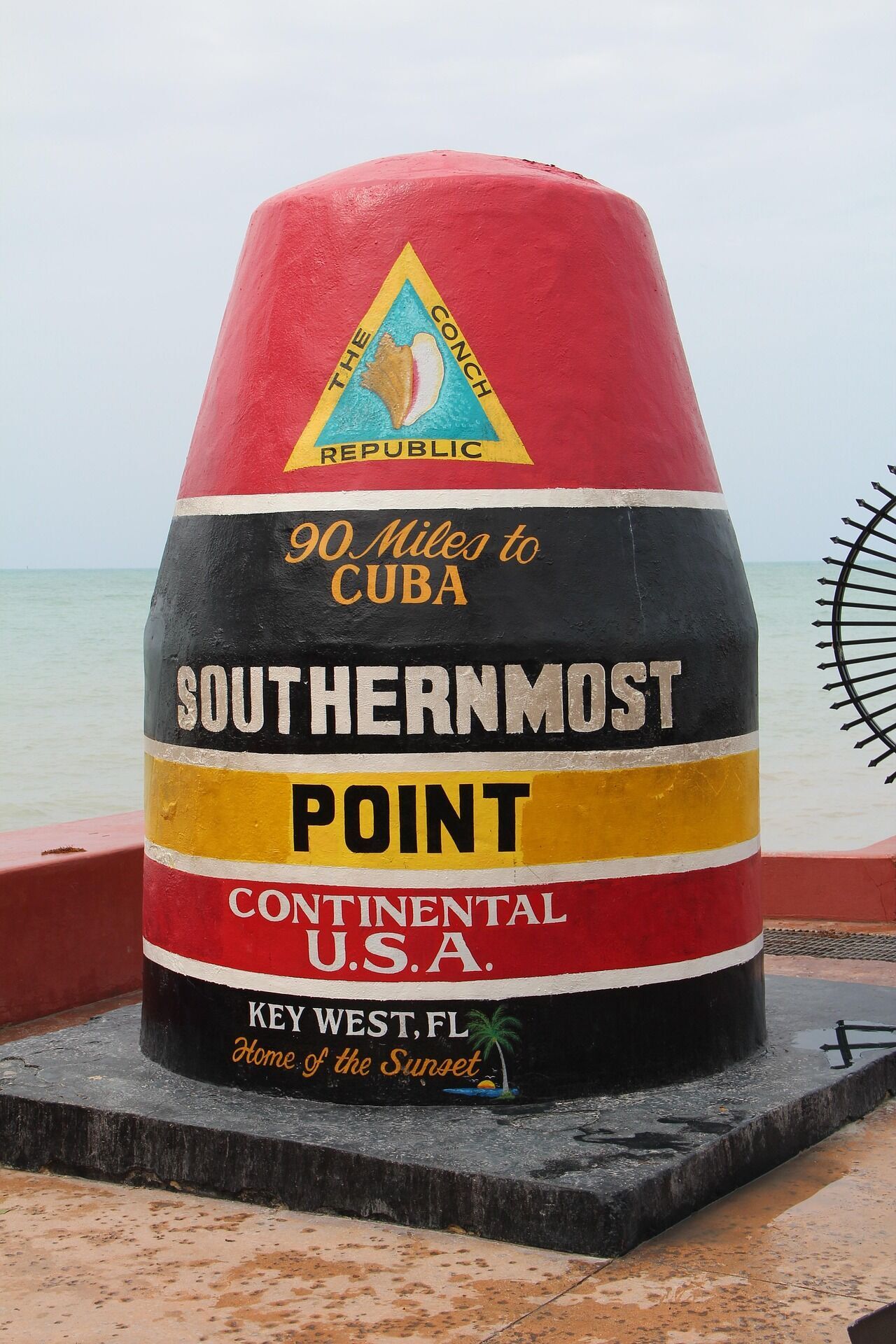 Southernmost Point marker in Key West, Florida, showing distance to Cuba