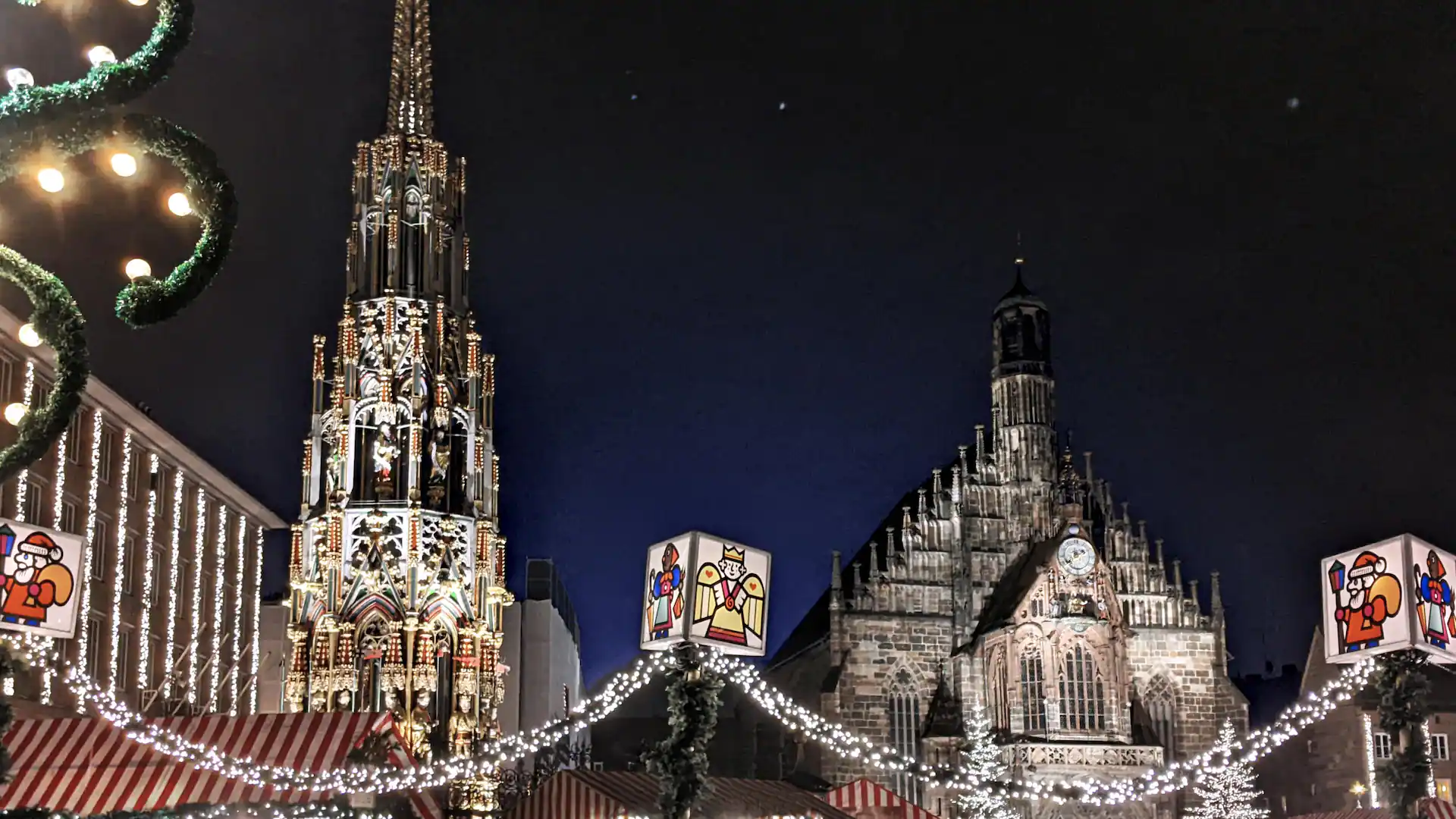 Nuremberg’s illuminated Christmas market with historic buildings at night