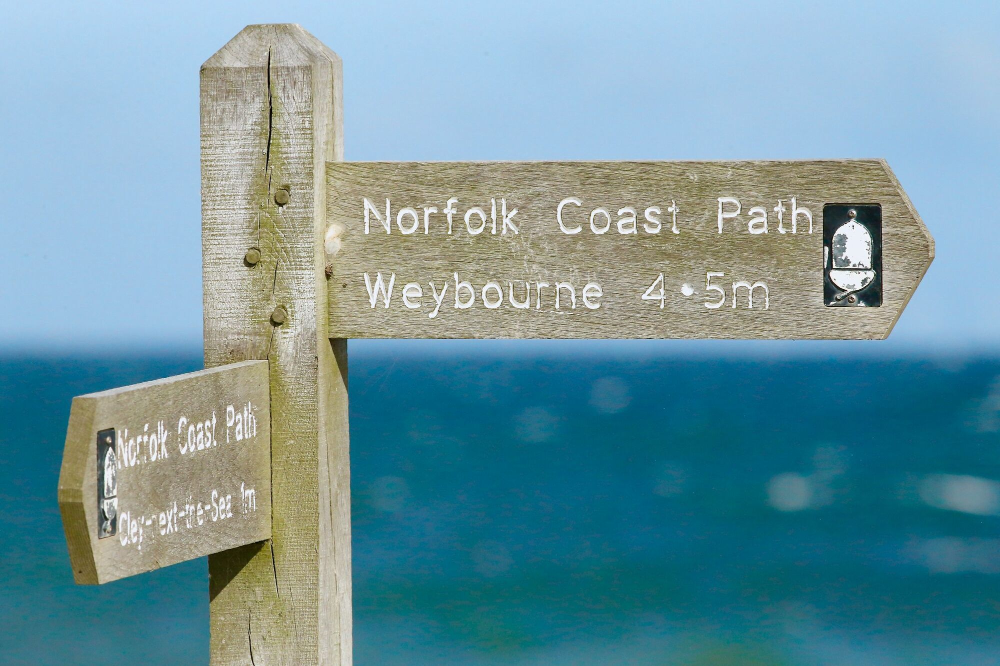 Signpost marking directions along the Norfolk Coast Path