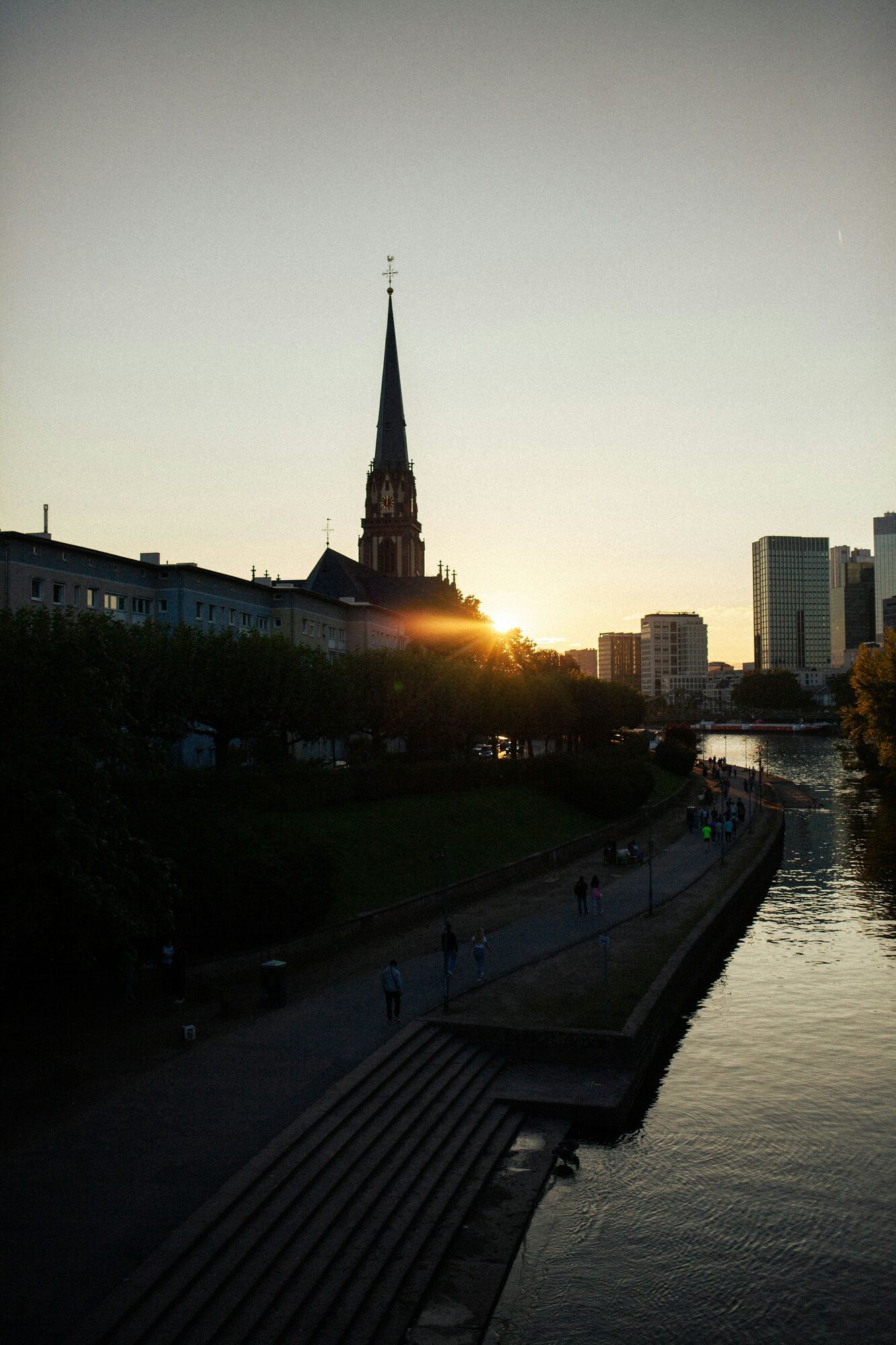 Main River promenade in Frankfurt’s Sachsenhausen district at sunset
