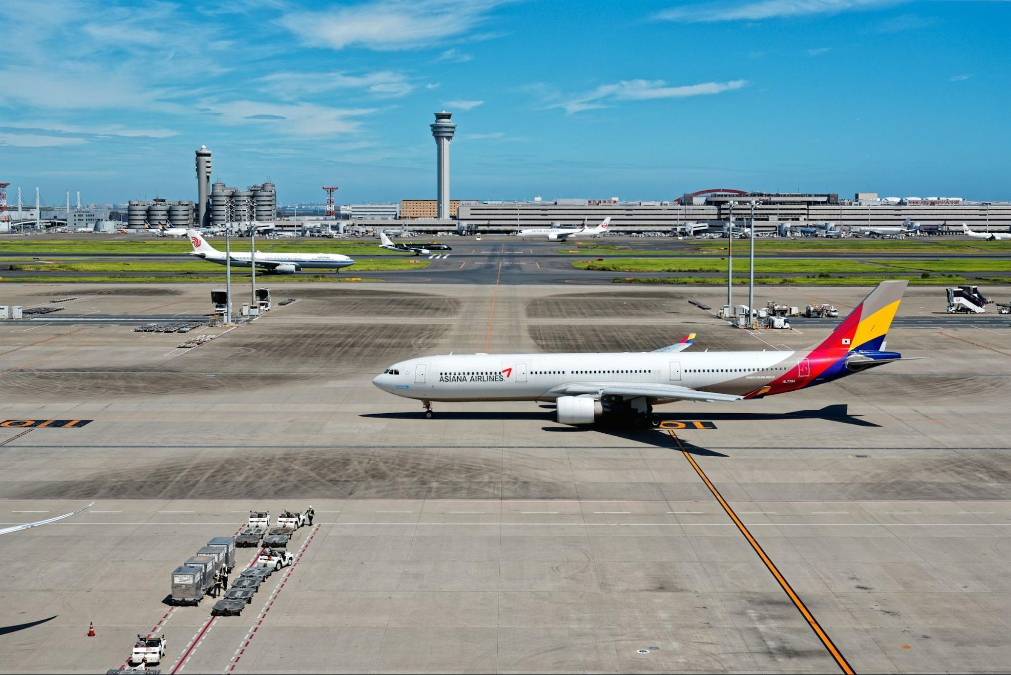 Asiana Airlines aircraft taxiing at an airport