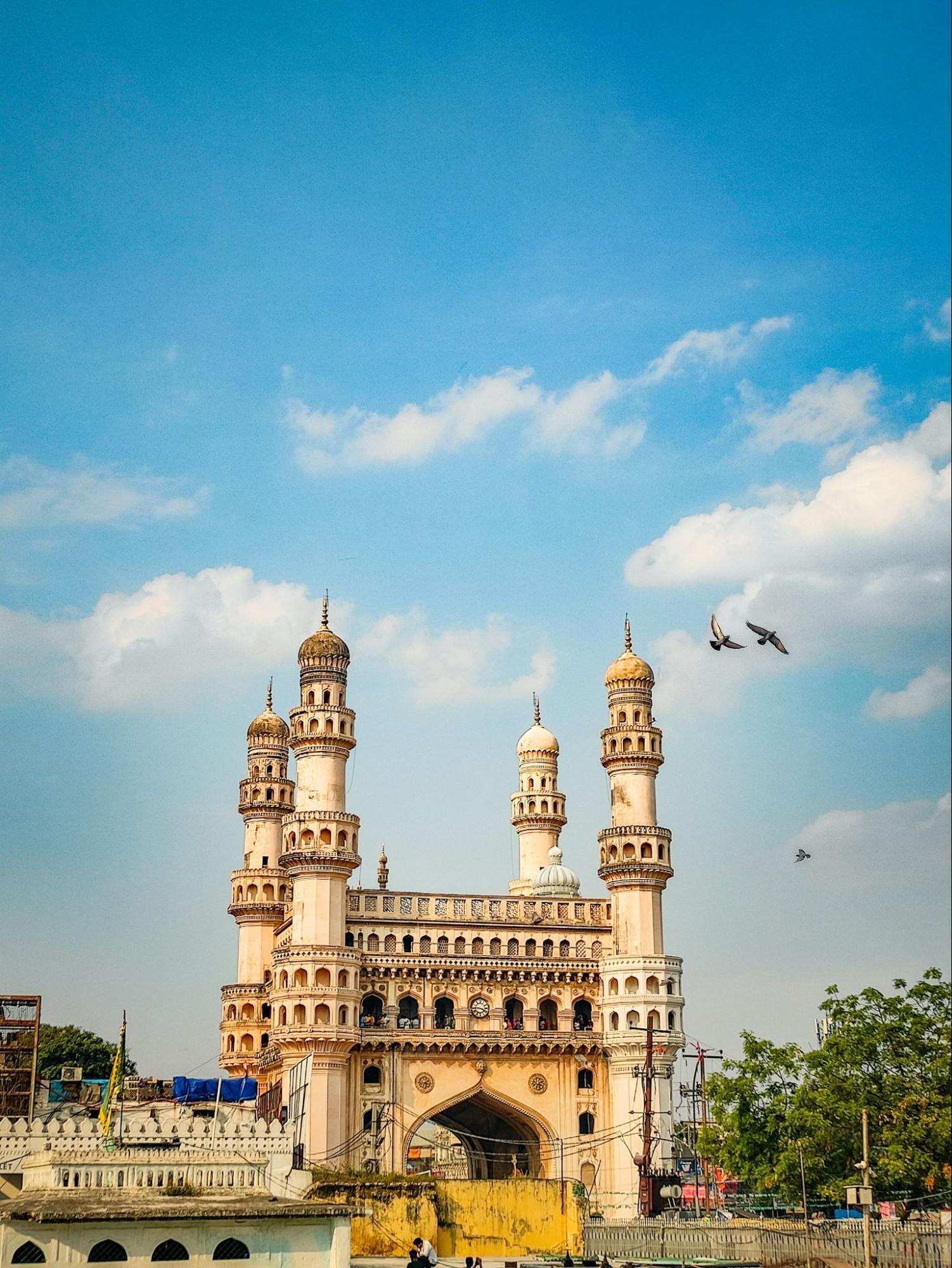 Charminar monument with bustling street market below