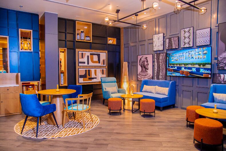 Colorful lounge area with modern seating and local artwork