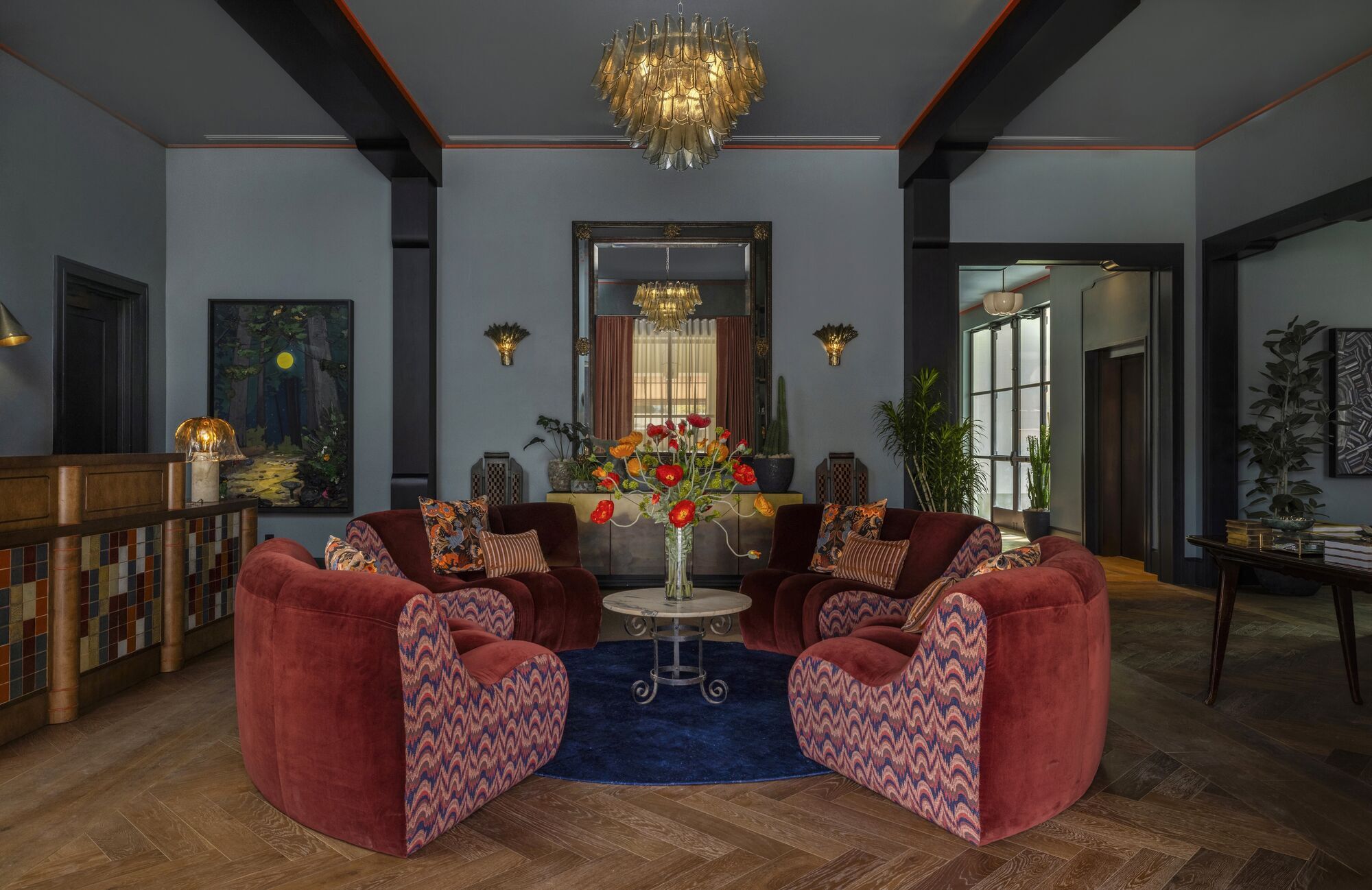 Hotel lobby with vintage-style seating and warm lighting