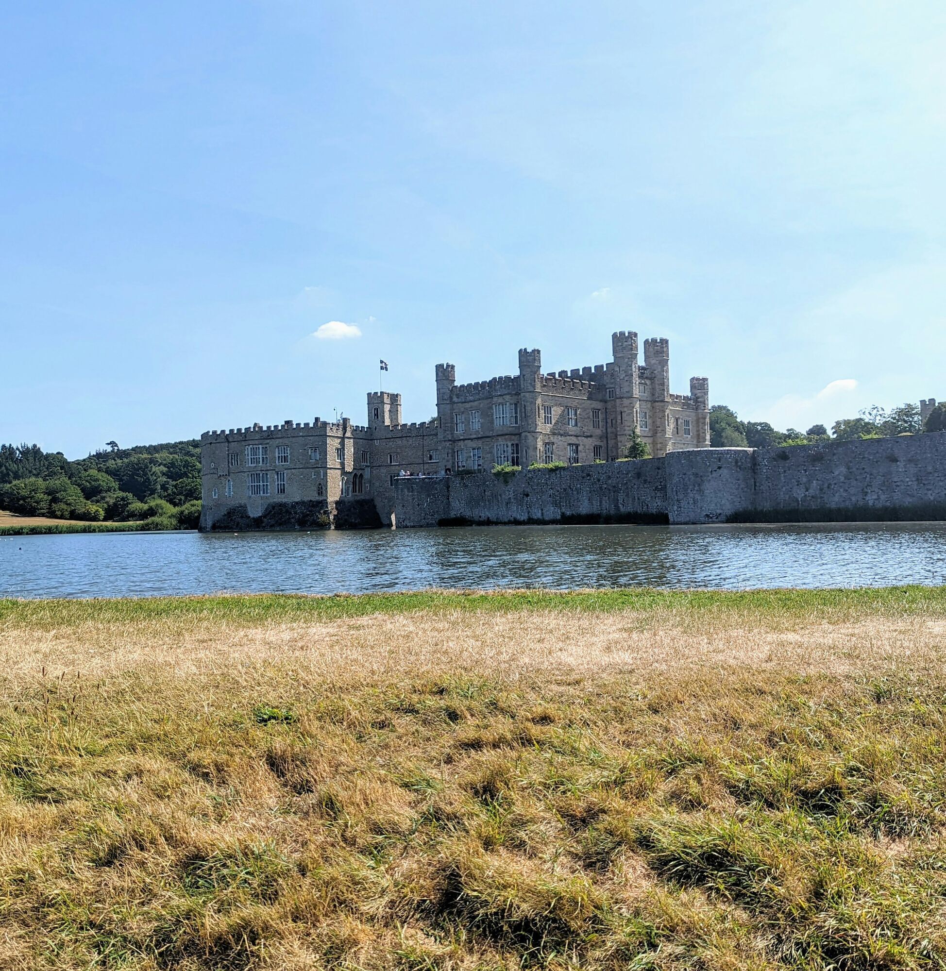 Leeds Castle surrounded by a moat on a sunny day in England