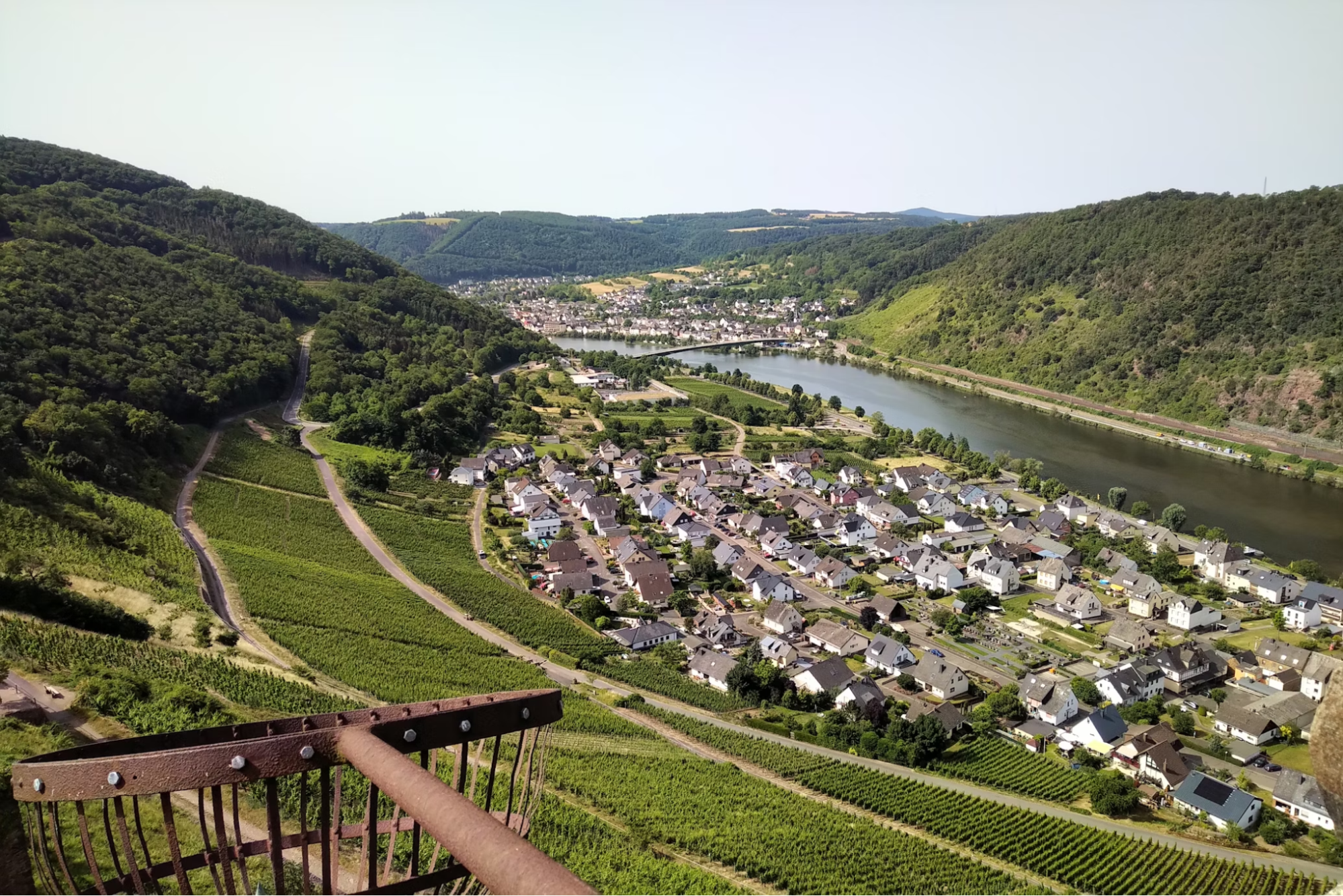 Aerial view of a village in the Moselle Valley with vineyards and a river