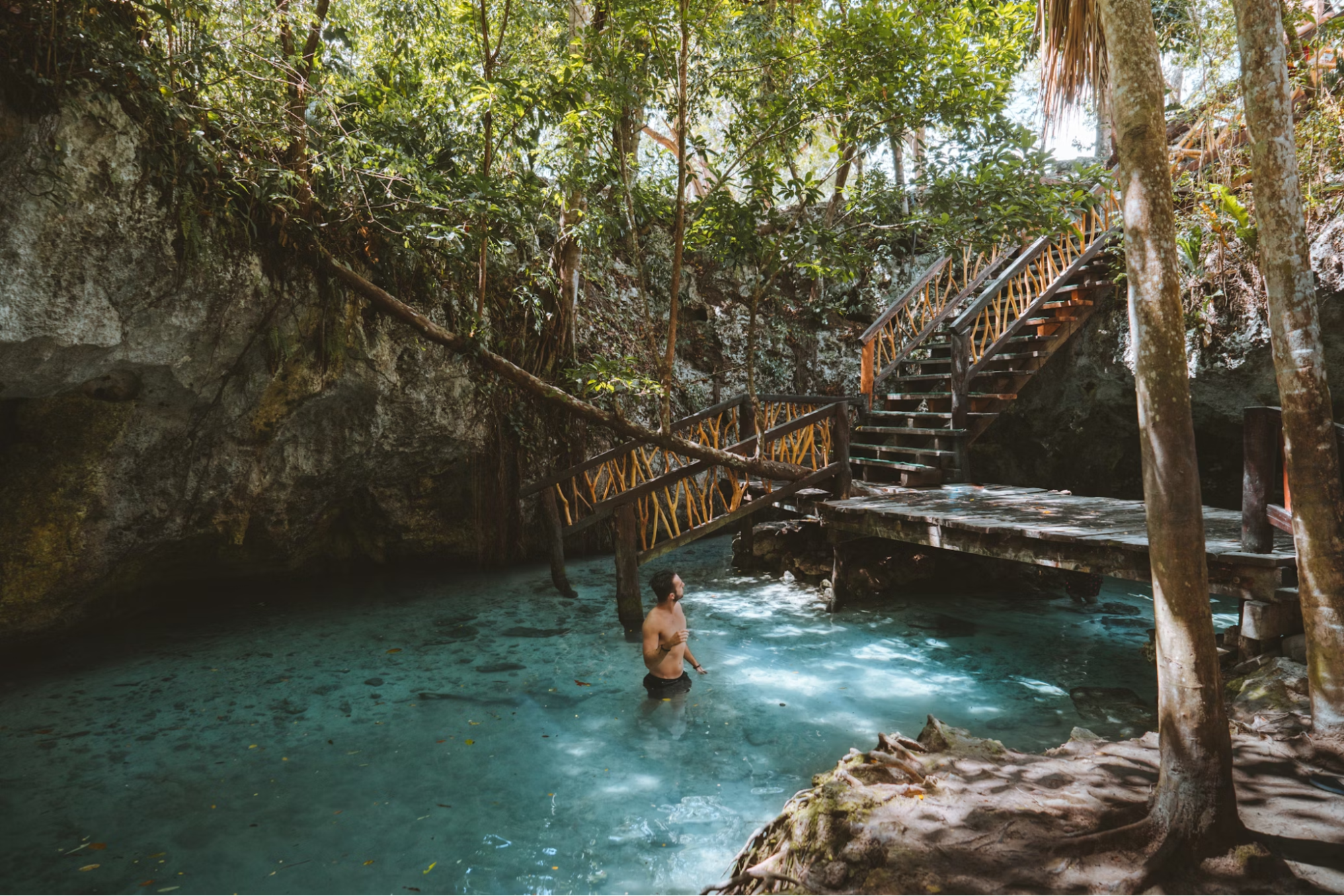 Person swimming in the clear waters of Gran Cenote in Riviera Maya