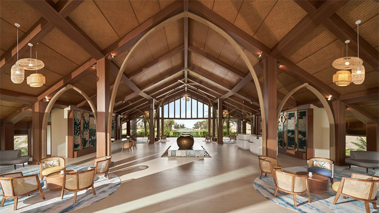Lobby interior of voco Quang Binh Resort with wooden arches and open beachside view