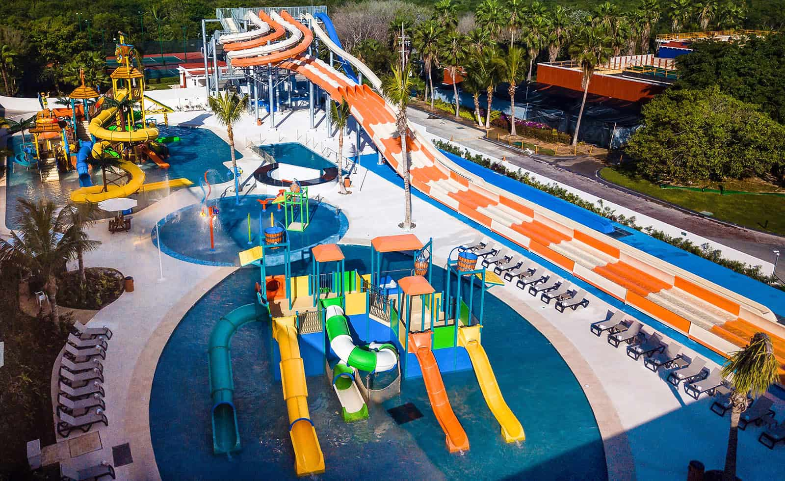Colorful water slides and pools at a tropical water park in Riviera Maya