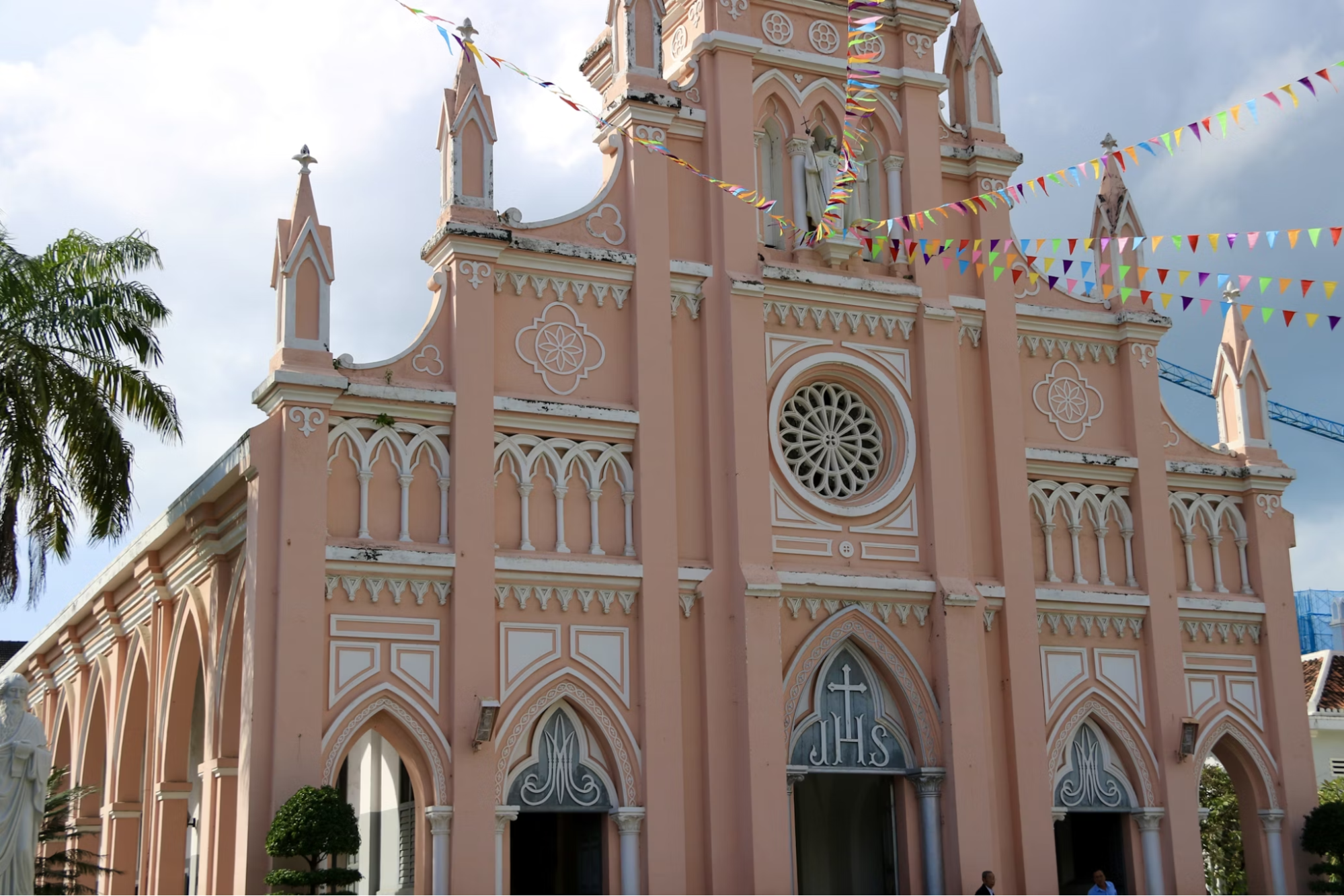 Pink-painted cathedral with Gothic-style architecture in Danang