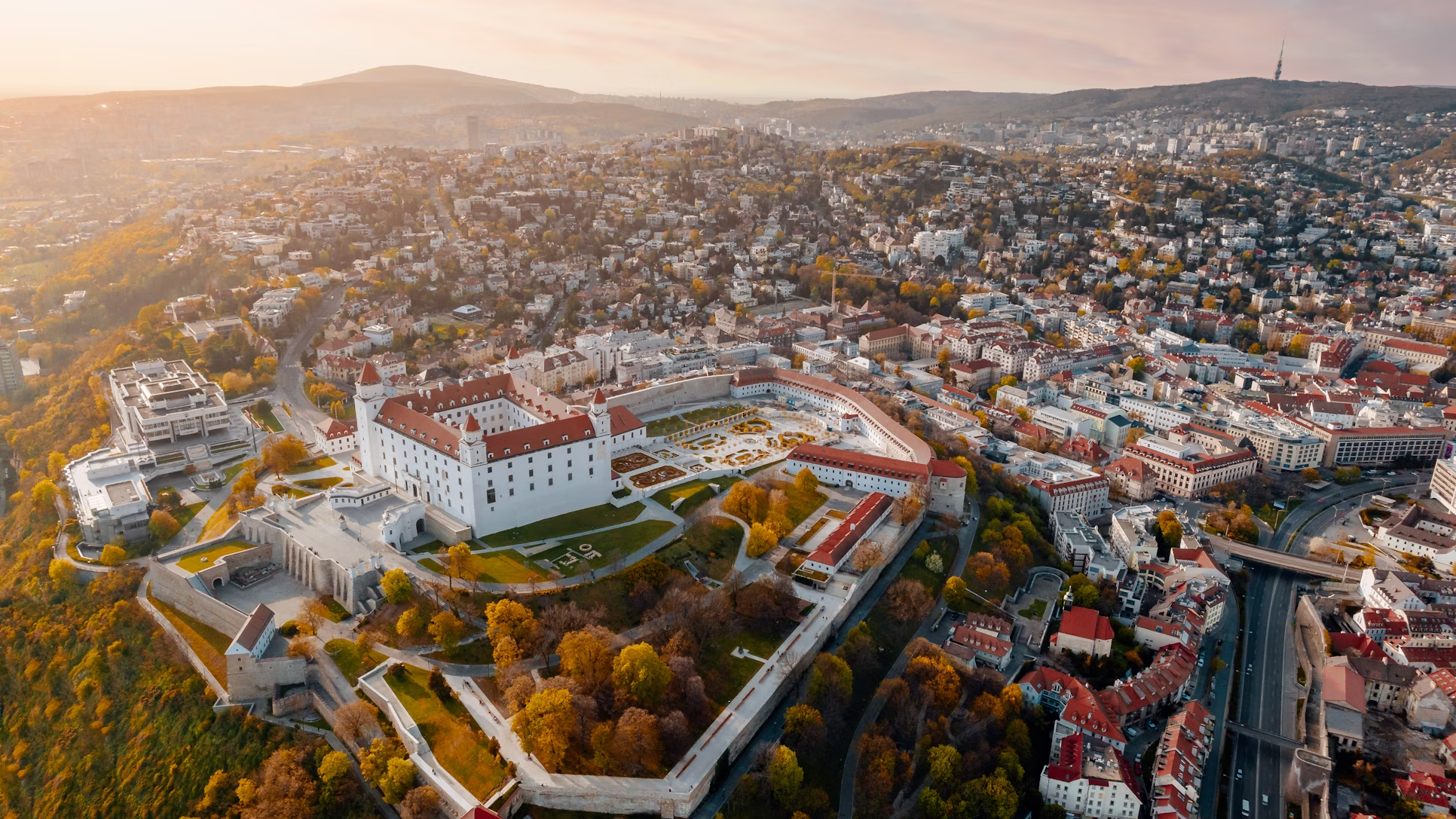 Aerial view of Bratislava Castle and cityscape during autumn