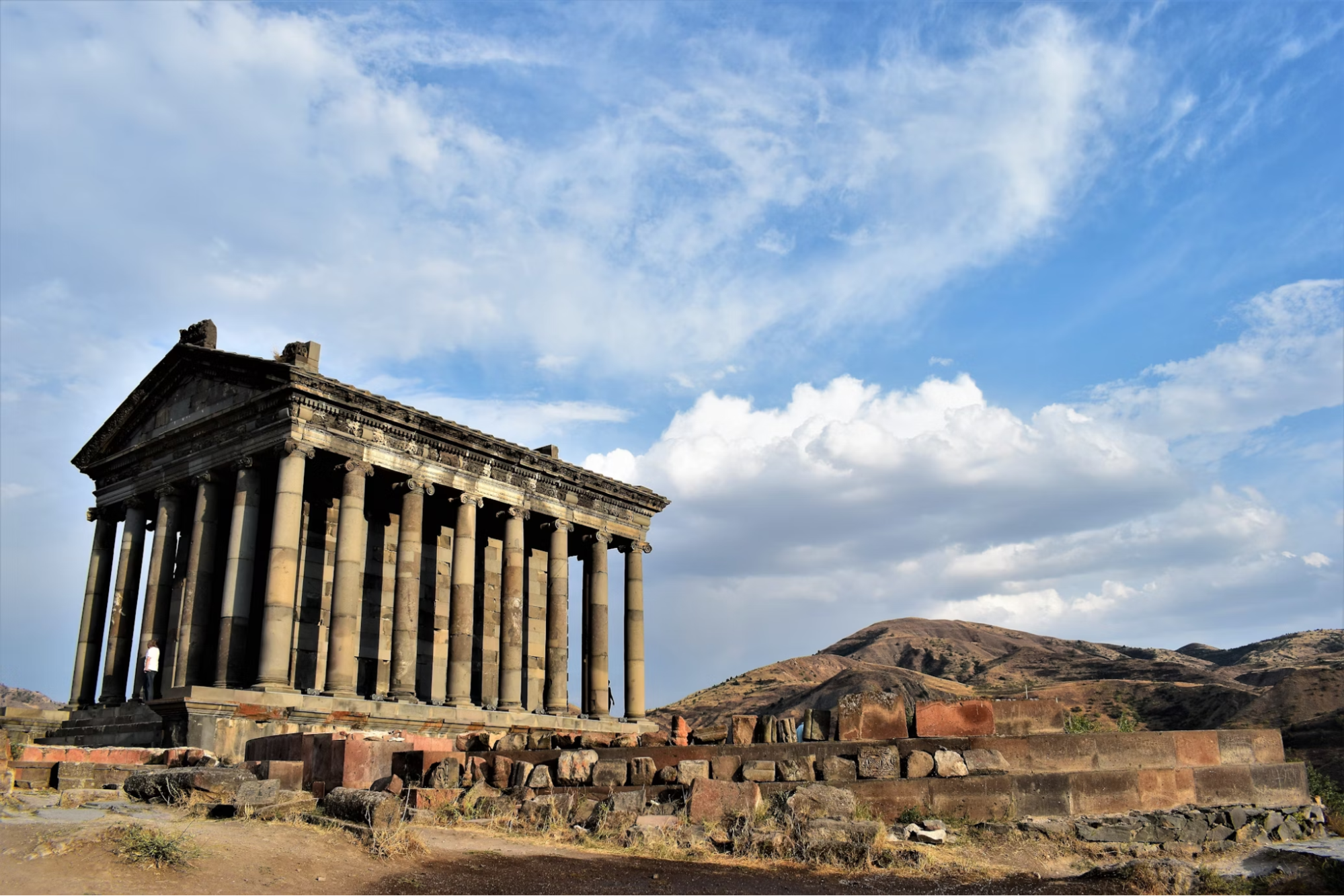 Garni Temple in Armenia with mountain backdrop