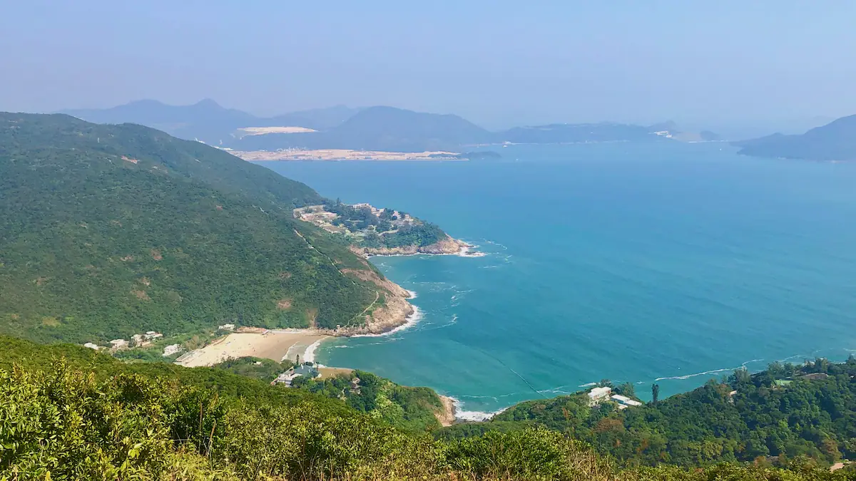 Scenic view from Dragon’s Back Trail in Hong Kong with coastline, greenery, and surrounding islands