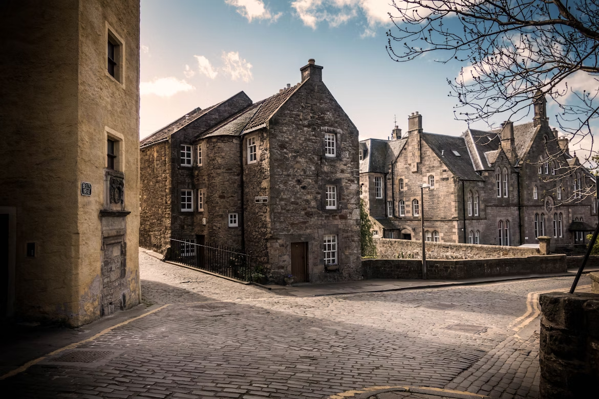 Quiet cobblestone street with historic stone buildings in Dean Village, Edinburgh