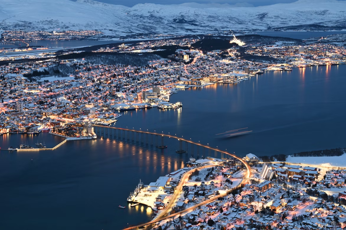 Aerial winter view of Tromsø with bridge and harbour lights
